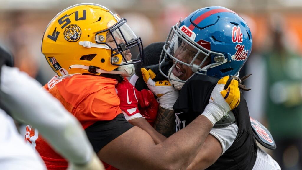 American team offensive lineman Miles Frazier of LSU (70) spars with American team defensive lineman Walter Nolen of Ole Miss (2) during Senior Bowl practice for the American team at Hancock Whitney Stadium.