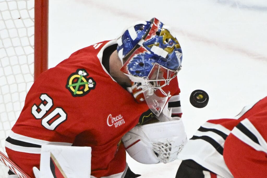 Mar 3, 2025; Chicago, Illinois, USA; Chicago Blackhawks goaltender Spencer Knight defends against the Los Angeles Kings during the second period at the United Center.