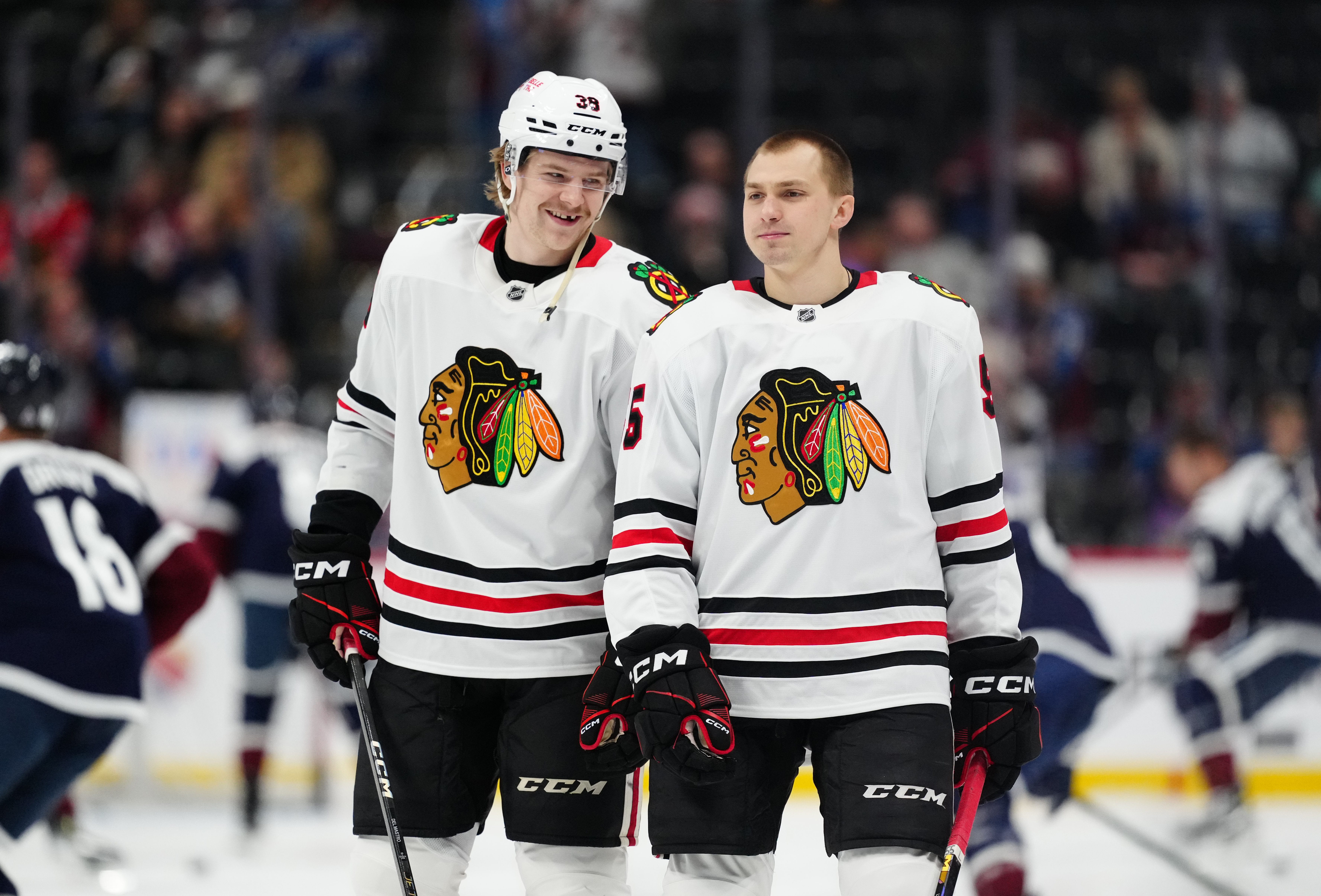 Mar 10, 2025; Denver, Colorado, USA; Chicago Blackhawks defenseman Ethan Del Mastro (38) and defenseman Artyom Levshunov (55) before the game against the Colorado Avalanche at Ball Arena.