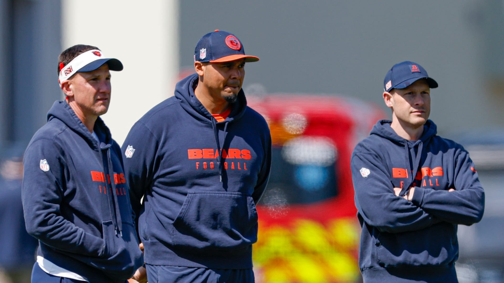 May 9, 2025; Lake Forest, IL, USA; Chicago Bears defensive coordinator Dennis Allen (L), general manager Ryan Poles (C) and head coach Ben Johnson (R) observe during the Rookie Minicamp at Halas Hall.