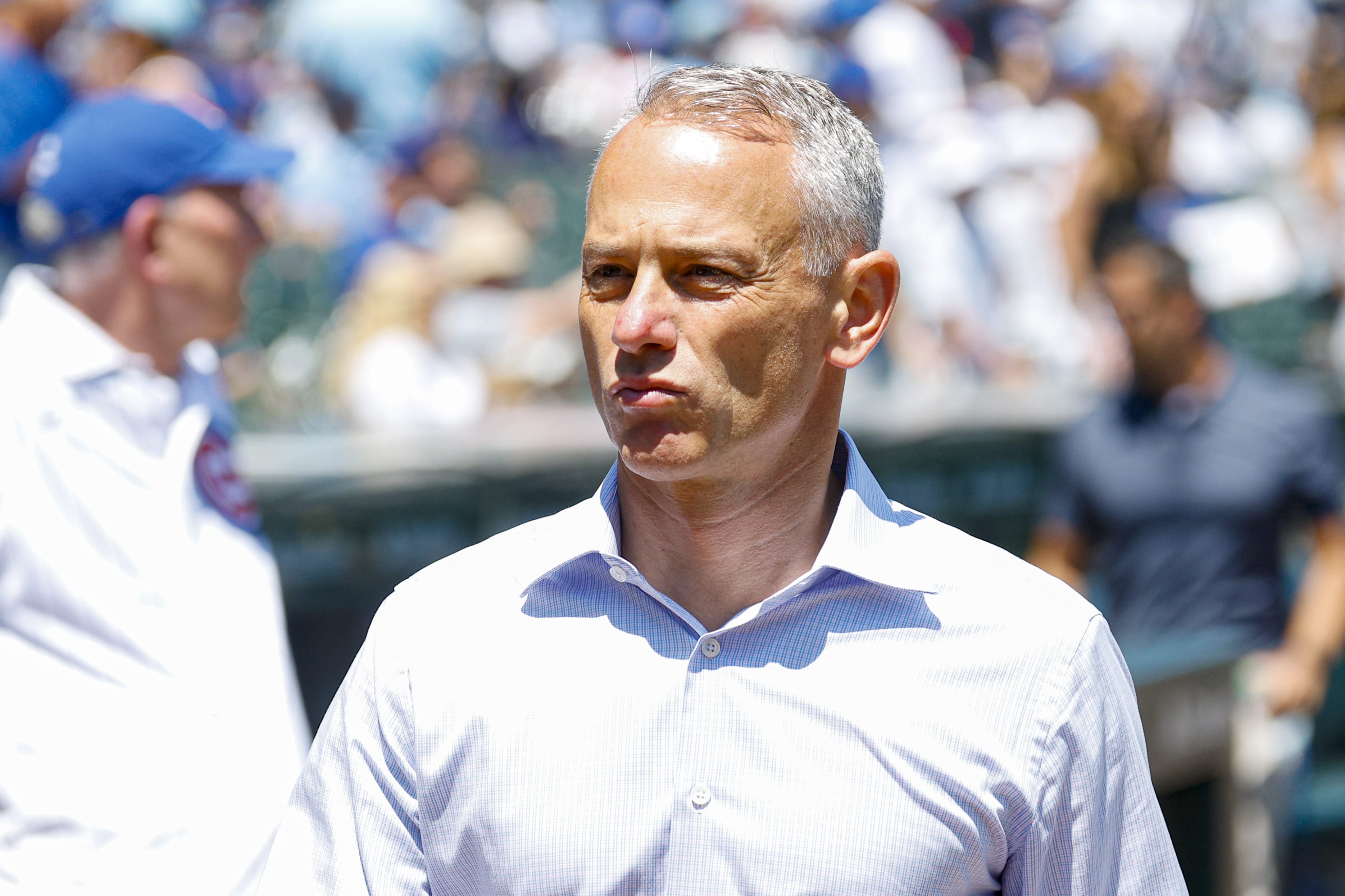 Jul 18, 2025; Chicago, Illinois, USA; Chicago Cubs President of Baseball Operations Jed Hoyer walks on the sidelines before a baseball game between the Chicago Cubs and Boston Red Sox at Wrigley Field.