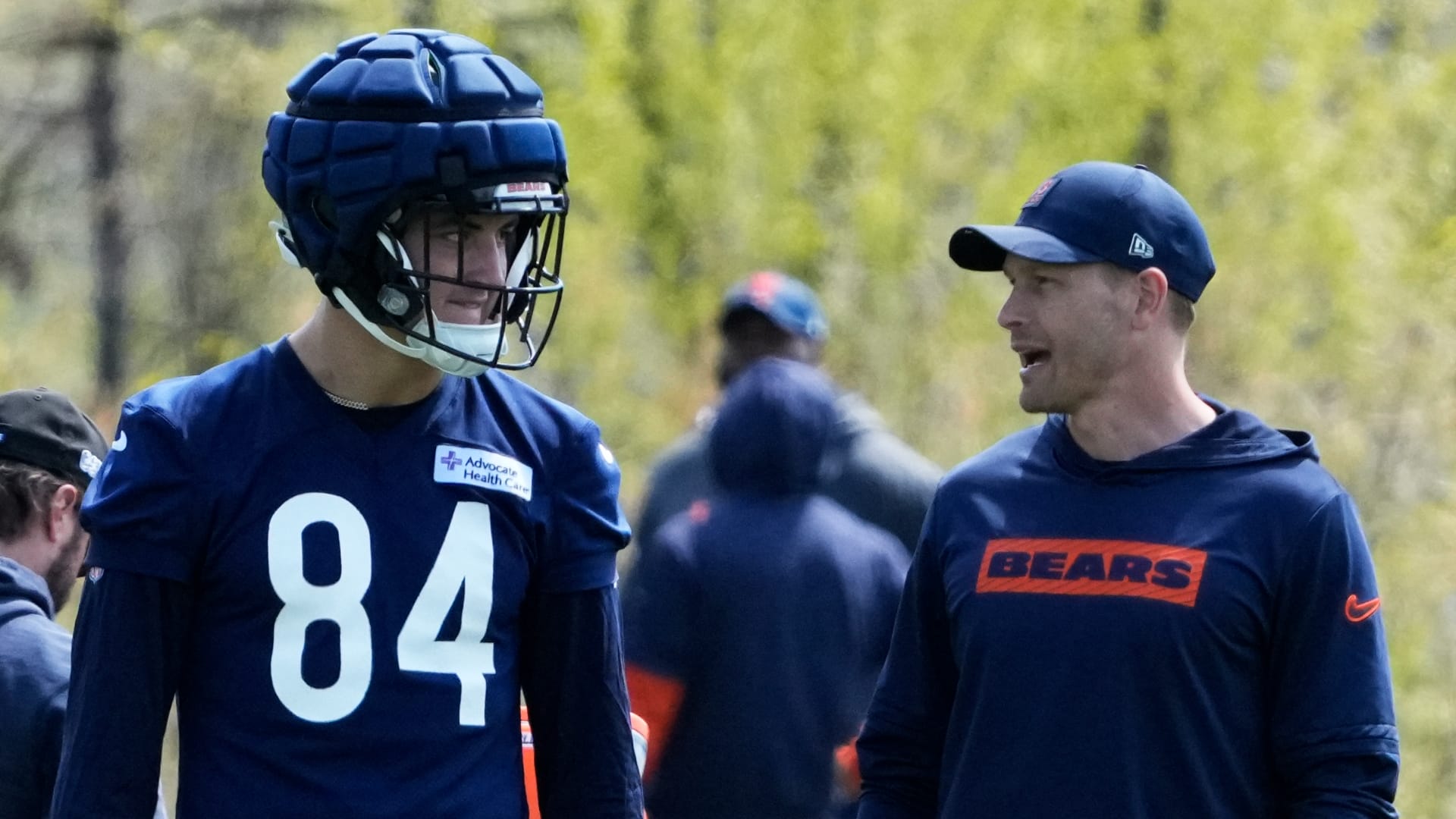 Chicago Bears head coach Ben Johnson talks with tight end (84) Colston Loveland during Rookie Minicamp at Halas Hall.