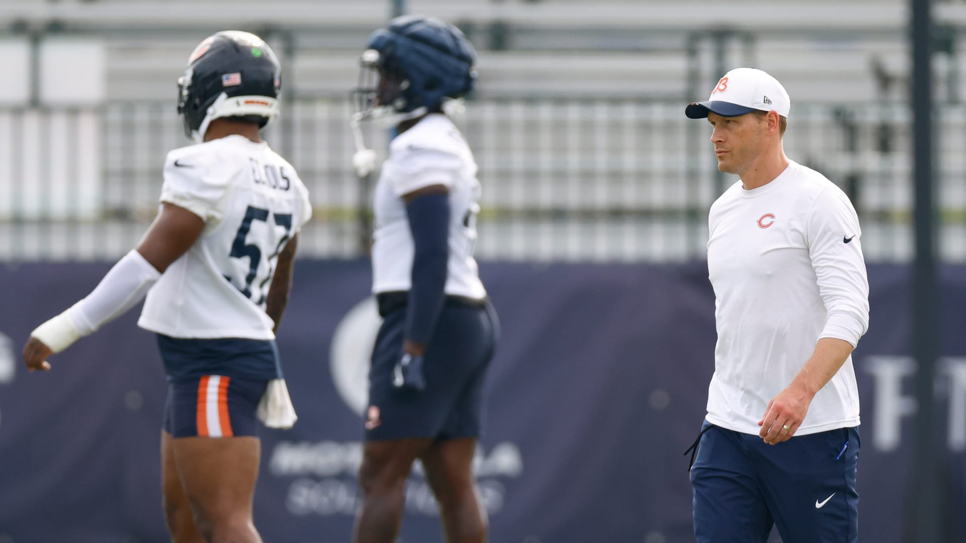 Chicago Bears head coach Ben Johnson walks on the field during training camp at Halas Hall.