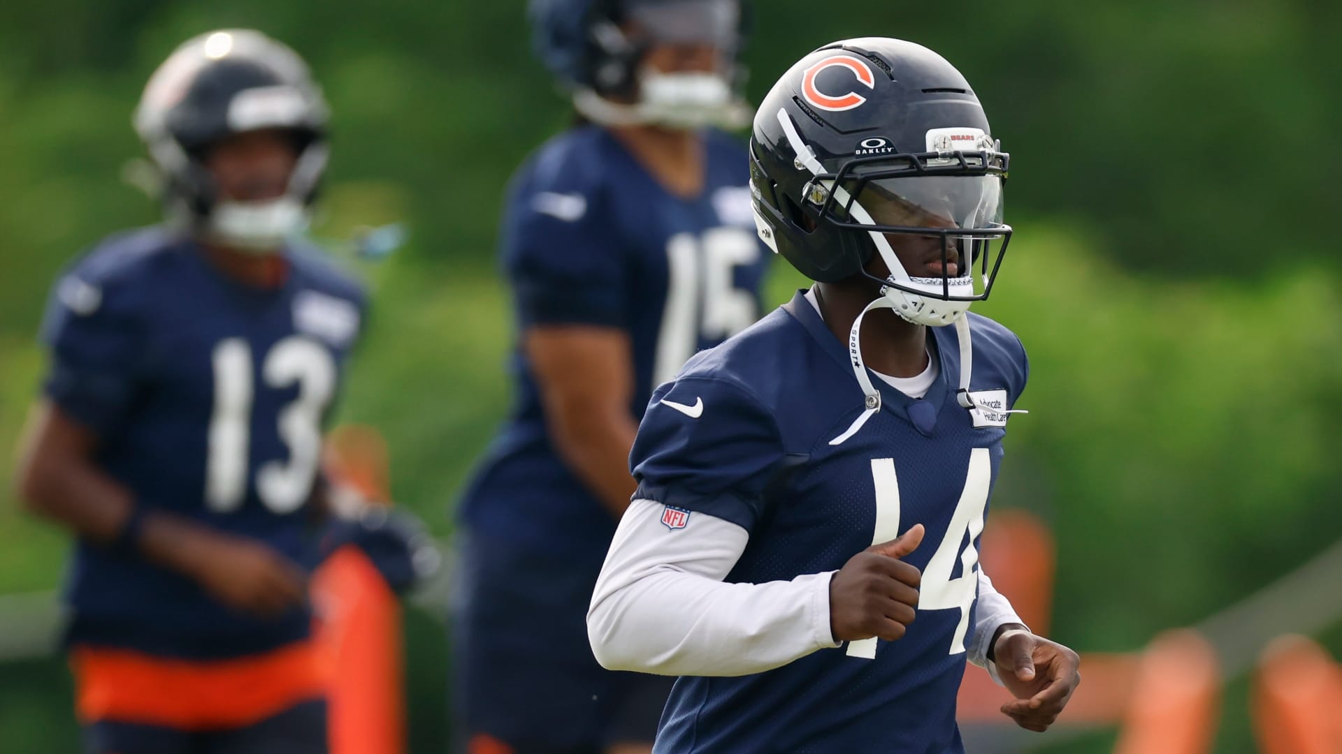 Chicago Bears wide receiver Olamide Zaccheaus (14) runs on the field during training camp at Halas Hall.