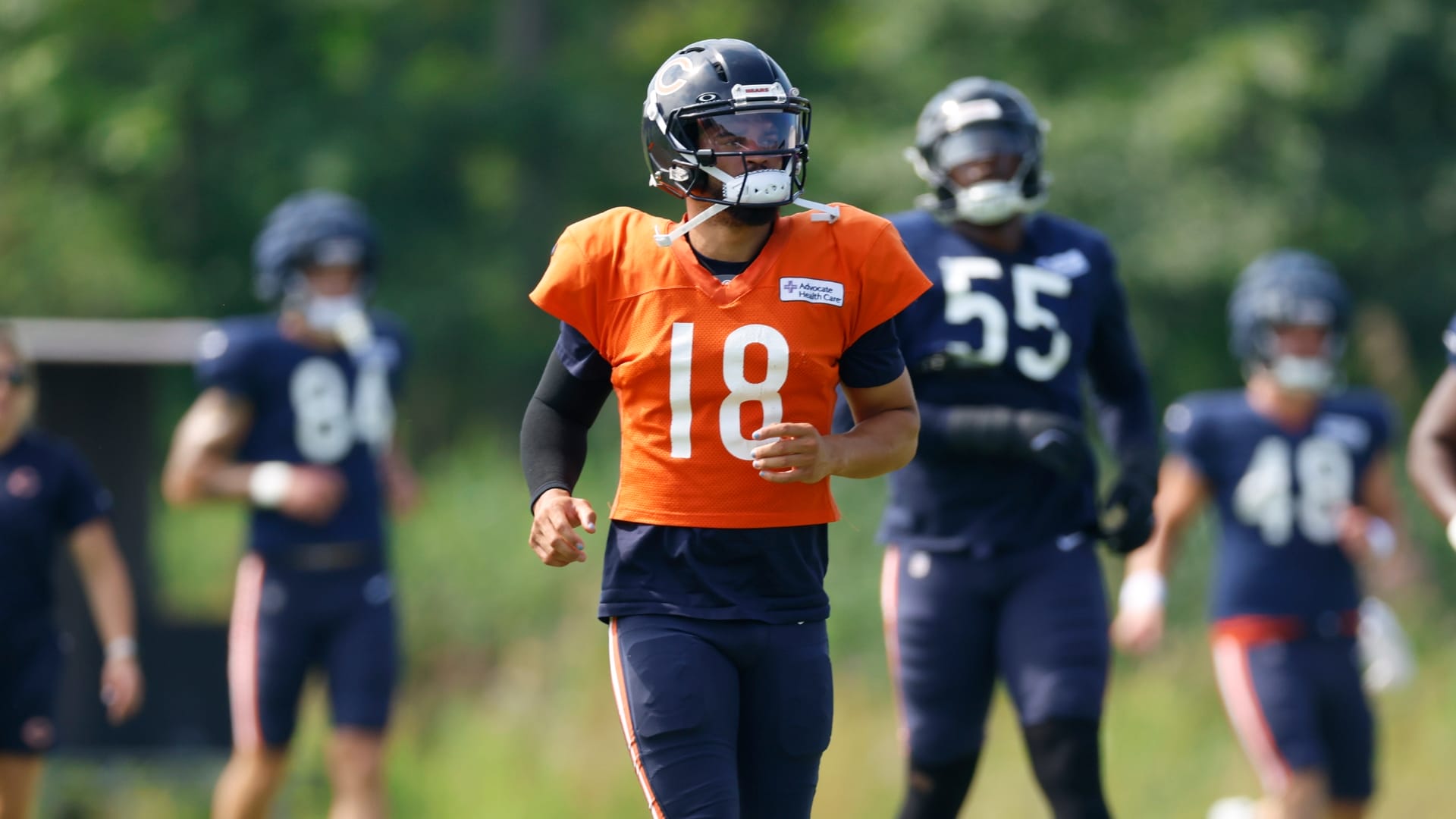 Chicago Bears quarterback Caleb Williams (18) warms up with teammates during joint training camp practice with the Buffalo Bills ahead of Sunday's preseason game.