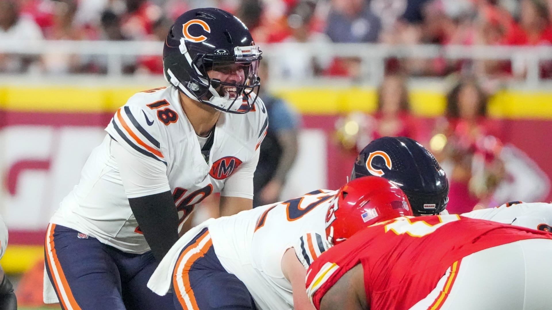 Chicago Bears quarterback Caleb Williams (18) goes under center against the Kansas City Chiefs during the game at GEHA Field at Arrowhead Stadium.