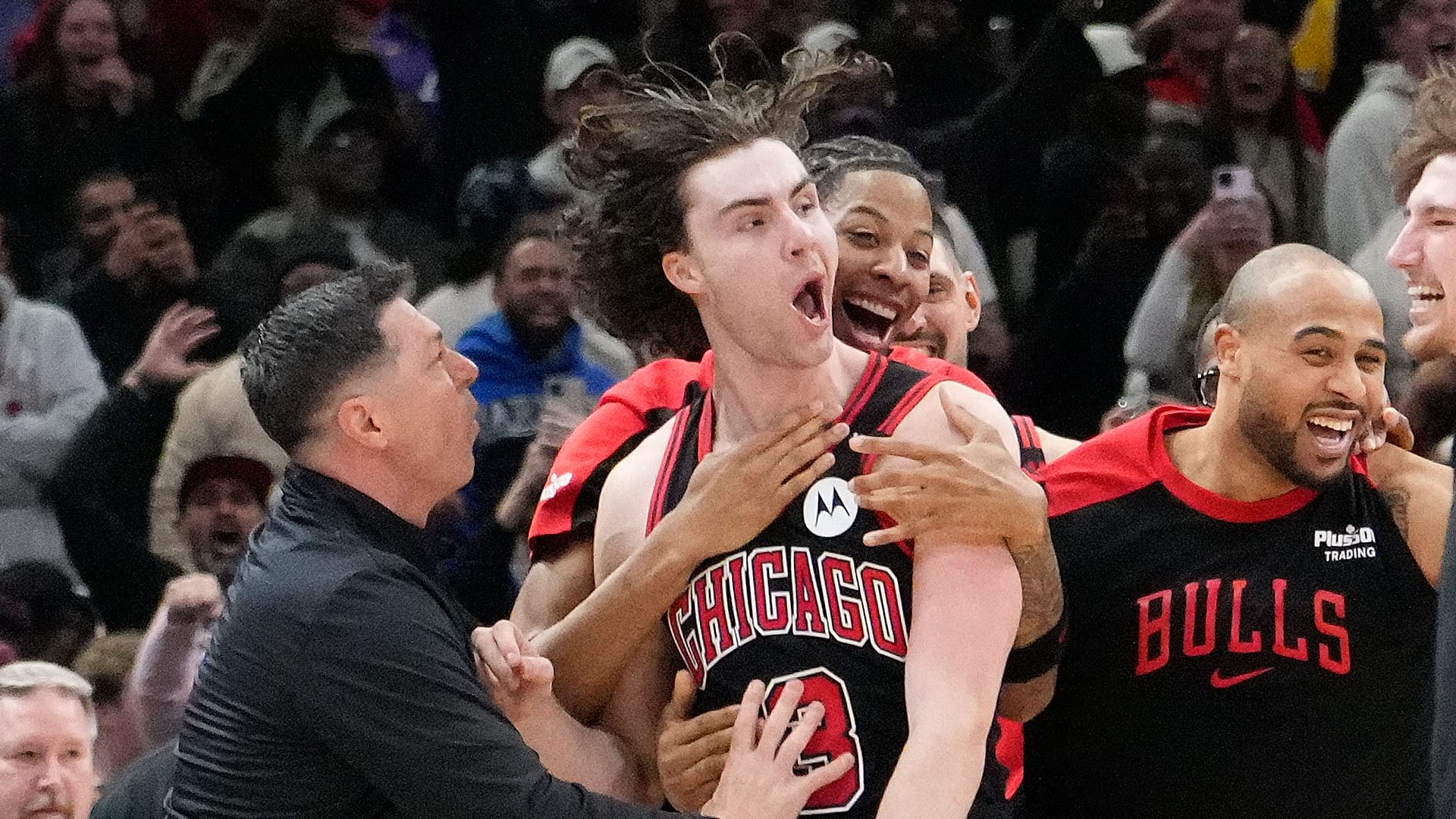 Chicago Bulls guard Josh Giddey (3) celebrates with teammates after making the game-winning three point basket against the Los Angeles Lakers during the second half at United Center.