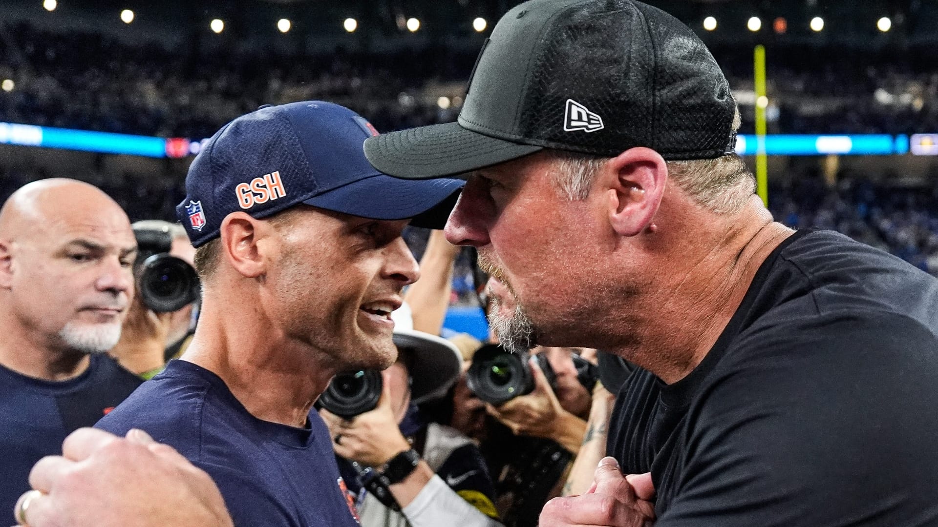 Detroit Lions head coach Dan Campbell, right, shakes hands with Chicago Bears head coach Ben Johnson after 52-21 win over the Bears at Ford Field in Detroit on Sunday, Sept. 14, 2025.