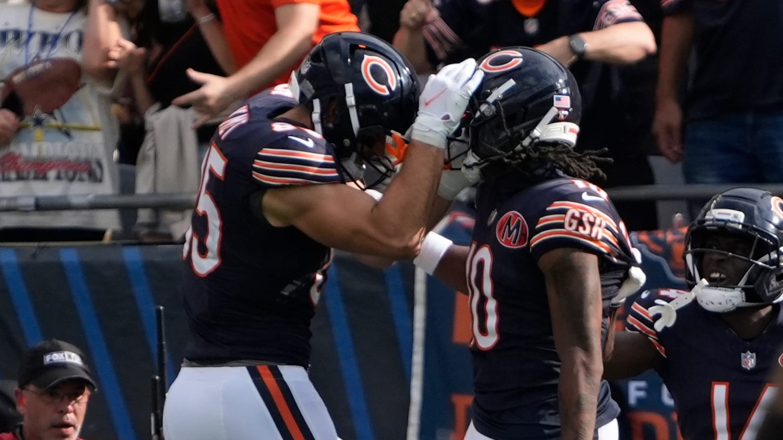 Chicago Bears wide receiver Luther Burden III (10) celebrates his touchdown reception with tight end Cole Kmet (85) against the Dallas Cowboys during the first half at Soldier Field.