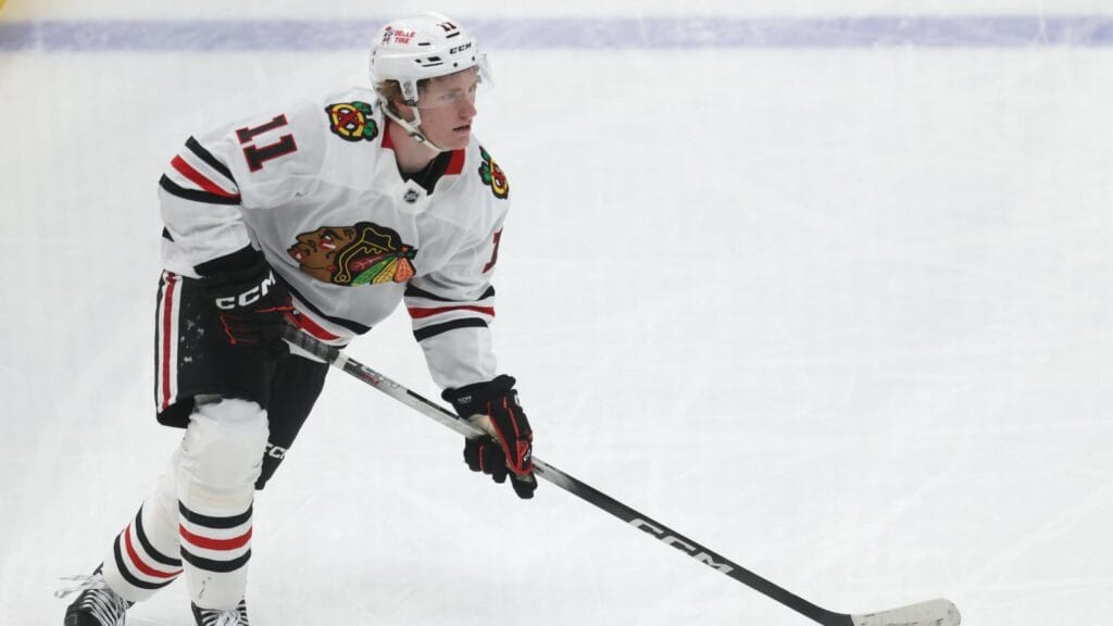 Apr 8, 2025; Pittsburgh, Pennsylvania, USA; Chicago Blackhawks center Oliver Moore (11) skates with the puck against the Pittsburgh Penguins during the second period at PPG Paints Arena.