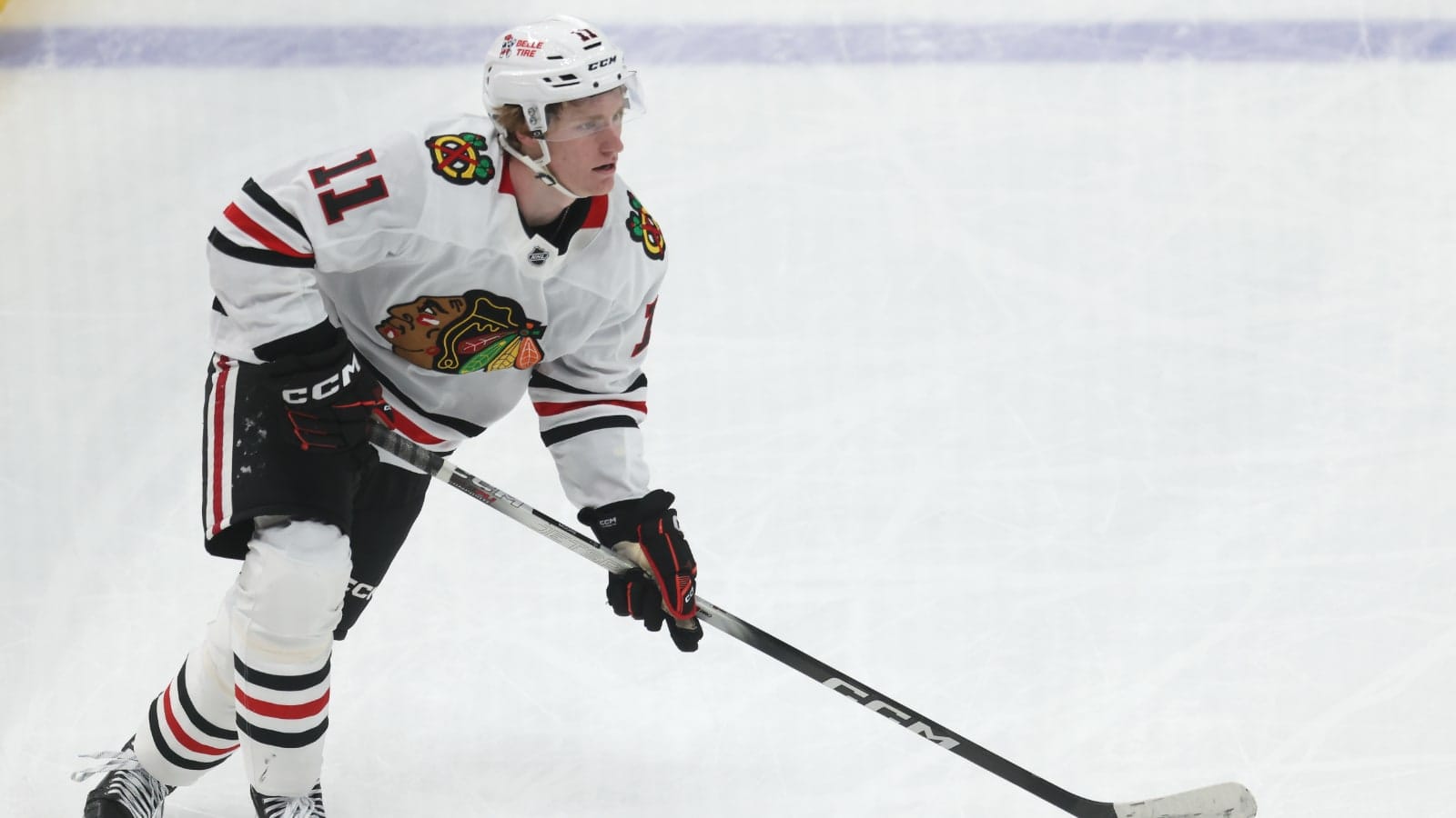 Apr 8, 2025; Pittsburgh, Pennsylvania, USA; Chicago Blackhawks center Oliver Moore (11) skates with the puck against the Pittsburgh Penguins during the second period at PPG Paints Arena.