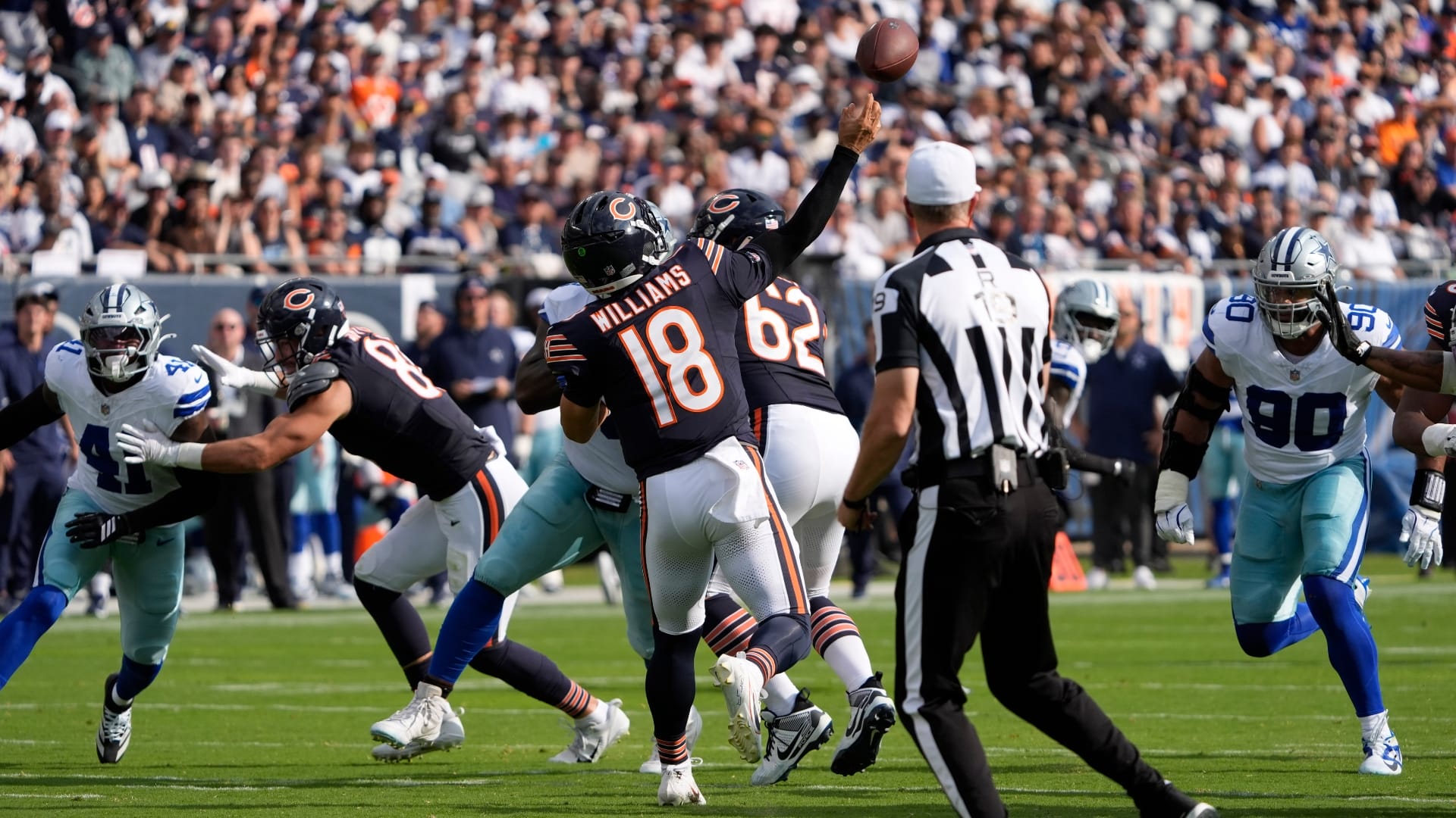 Chicago Bears quarterback Caleb Williams (18) throws a touchdown pass against the Dallas Cowboys during the first half at Soldier Field.