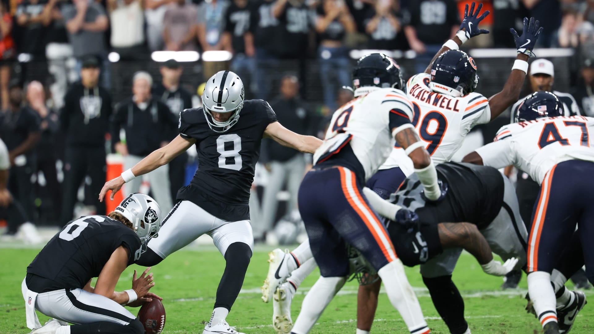 Sep 28, 2025; Paradise, Nevada, USA; Las Vegas Raiders kicker Daniel Carlson (8) attempts a field goal kick during the second half against the Chicago Bears at Allegiant Stadium.