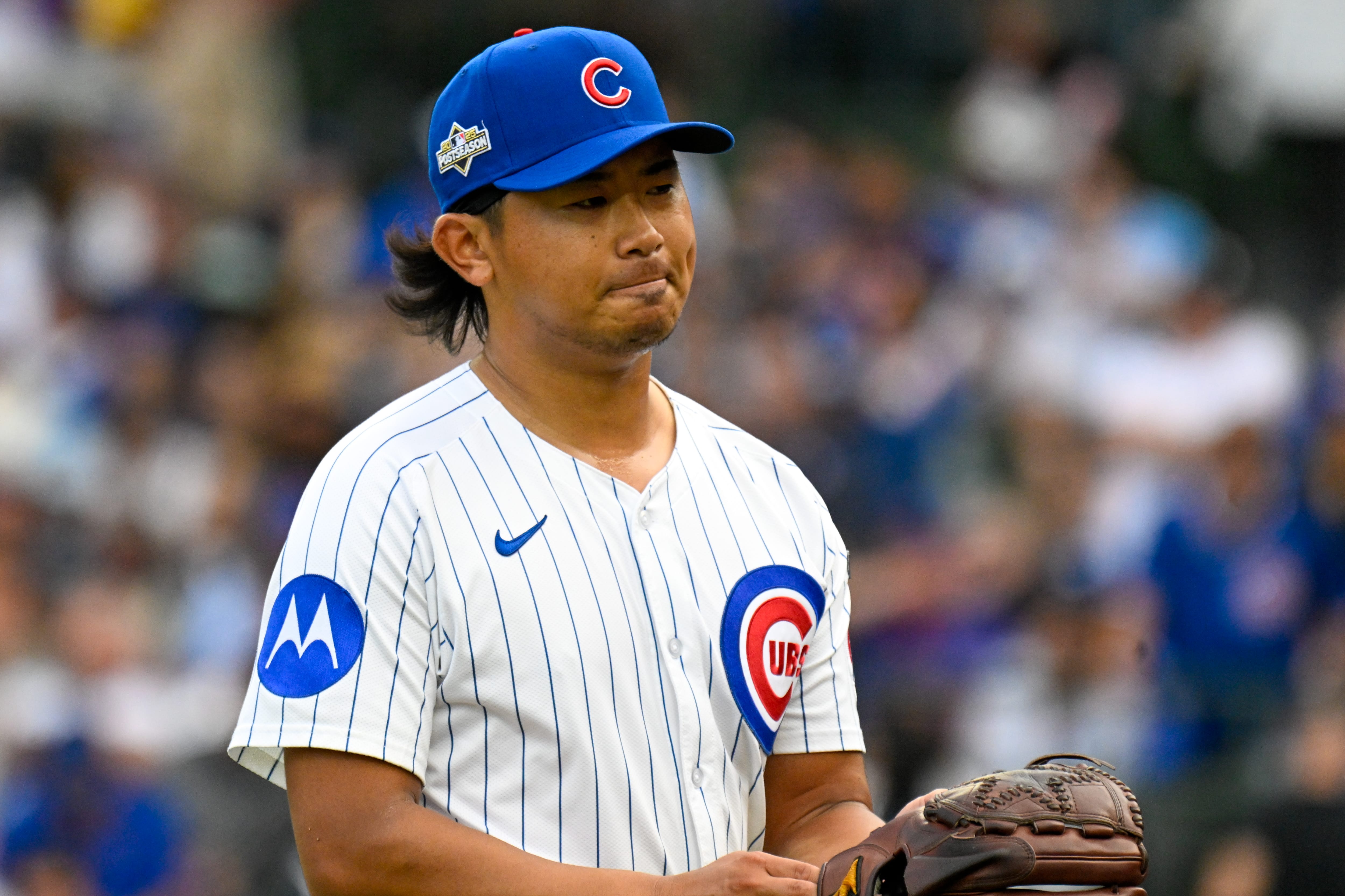 Oct 1, 2025; Chicago, Illinois, USA; Chicago Cubs relief pitcher Shota Imanaga (18) leaves the mound for a pitching change after giving up a two-run home run in the fifth inning against the San Diego Padres during game two of the Wildcard round for the 2025 MLB playoffs at Wrigley Field.