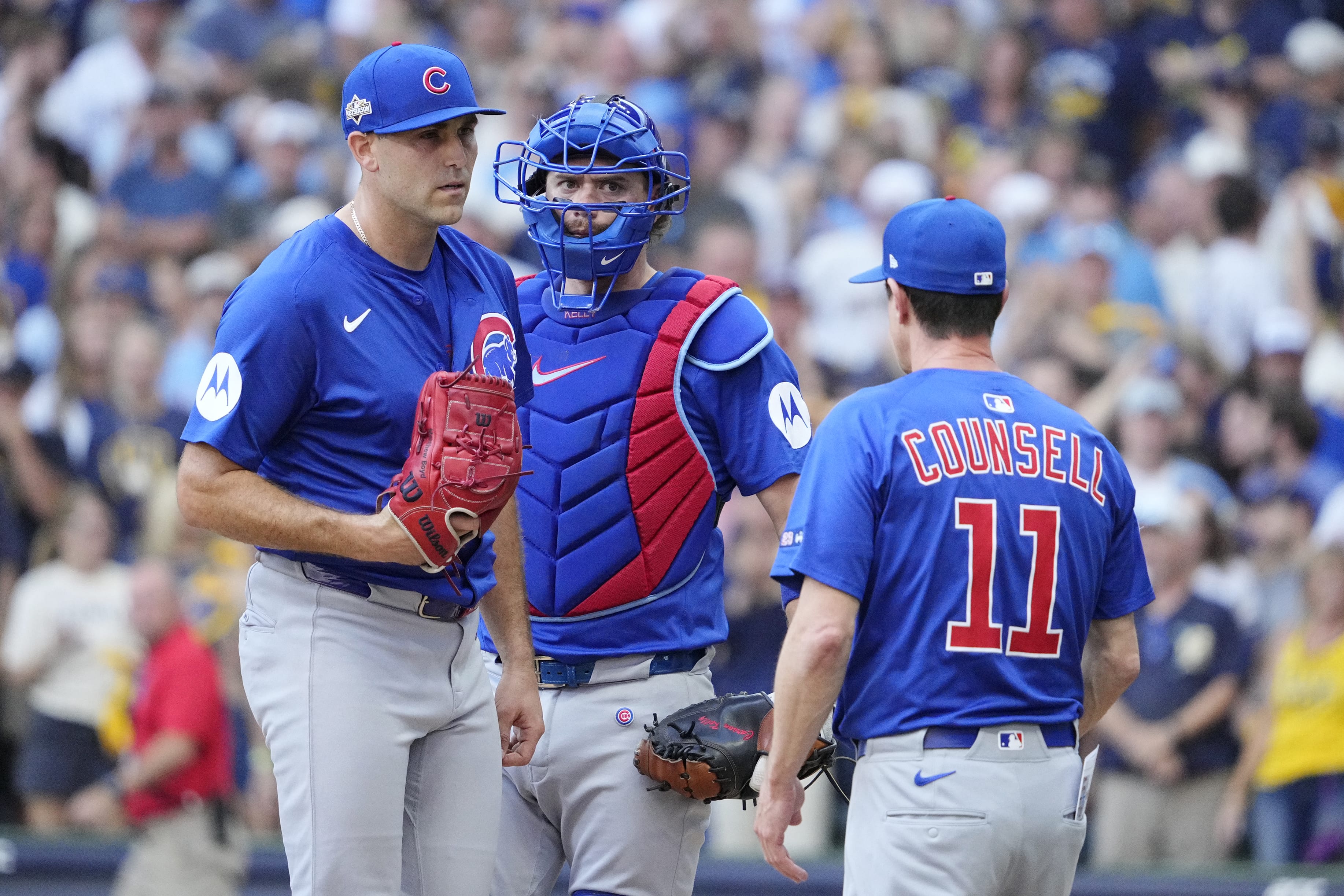 Oct 4, 2025; Milwaukee, Wisconsin, USA; Chicago Cubs left fielder Willi Castro (1) takes starting pitcher Matthew Boyd (16) out of the game against the Milwaukee Brewers during the first inning of game one of the NLDS round for the 2025 MLB playoffs at American Family Field.