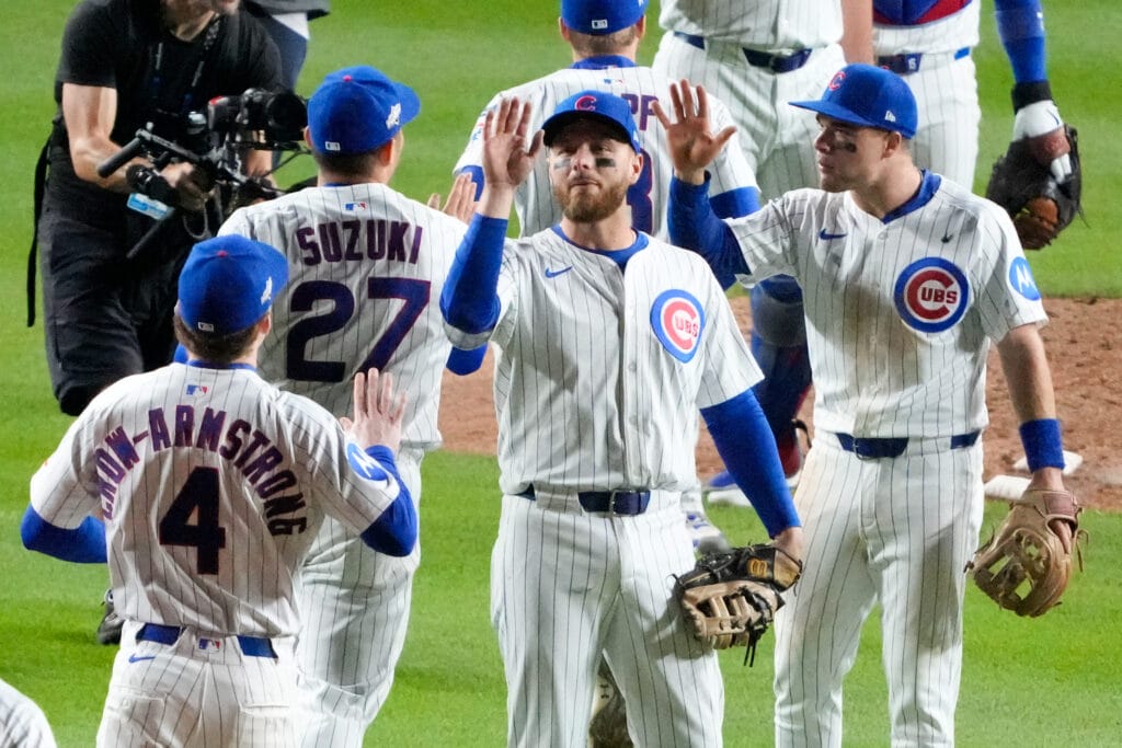 Oct 8, 2025; Chicago, Illinois, USA; The Chicago Cubs congratulate pitcher Brad Keller (40) after defeating the Milwaukee Brewers in game three of the NLDS round for the 2025 MLB playoffs at Wrigley Field.