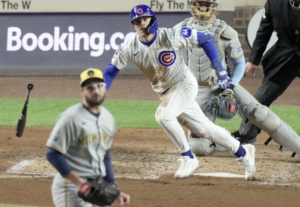 Oct 9, 2025; Chicago, Illinois, USA; Chicago Cubs third baseman Matt Shaw (6) hits an RBI single during the sixth inning against the Milwaukee Brewers  during game four of the NLDS round for the 2025 MLB playoffs at Wrigley Field.