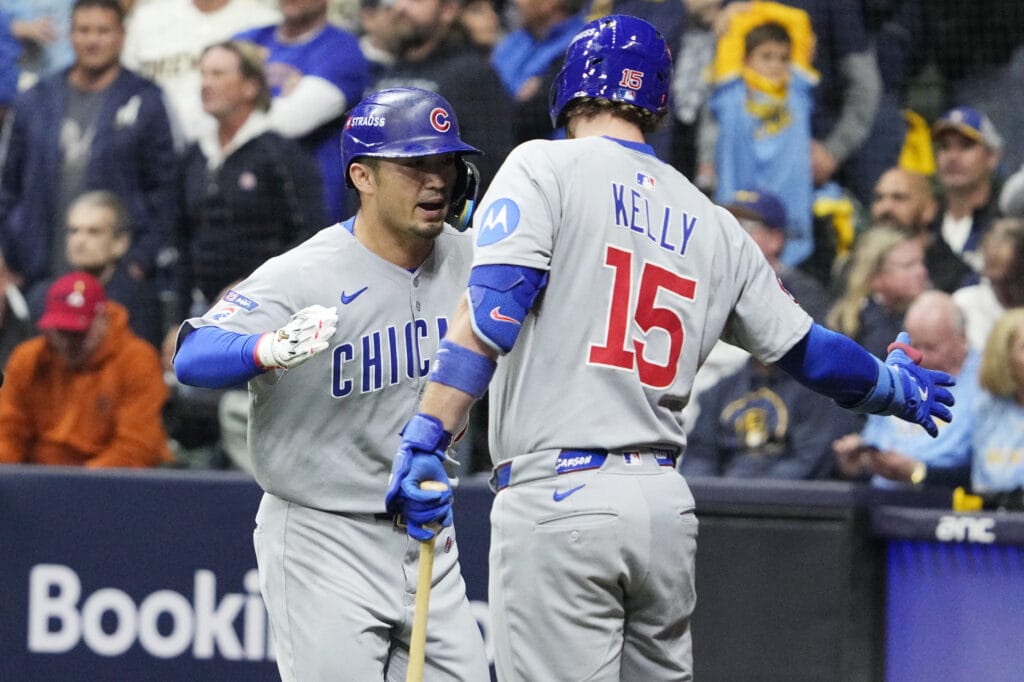 Oct 11, 2025; Milwaukee, Wisconsin, USA; Chicago Cubs right fielder Seiya Suzuki (27) celebrates with catcher Carson Kelly (15) after hitting a solo home run against the Milwaukee Brewers in the second inning during game five of the NLDS round for the 2025 MLB playoffs at American Family Field.