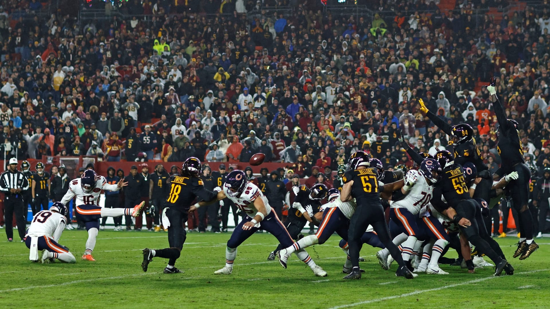 Chicago Bears kicker Jake Moody (16) kicks a game-winning field goal against the Washington Commanders during the fourth quarter at Northwest Stadium.