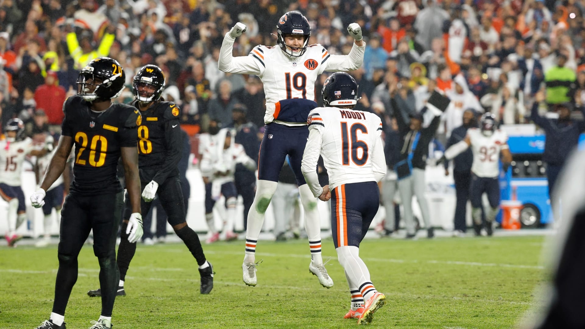 Oct 13, 2025; Landover, Maryland, USA; Chicago Bears kicker Jake Moody (16) celebrates with punter Tory Taylor (19) after kicking a game-winning field goal against the Washington Commanders during the fourth quarter at Northwest Stadium.