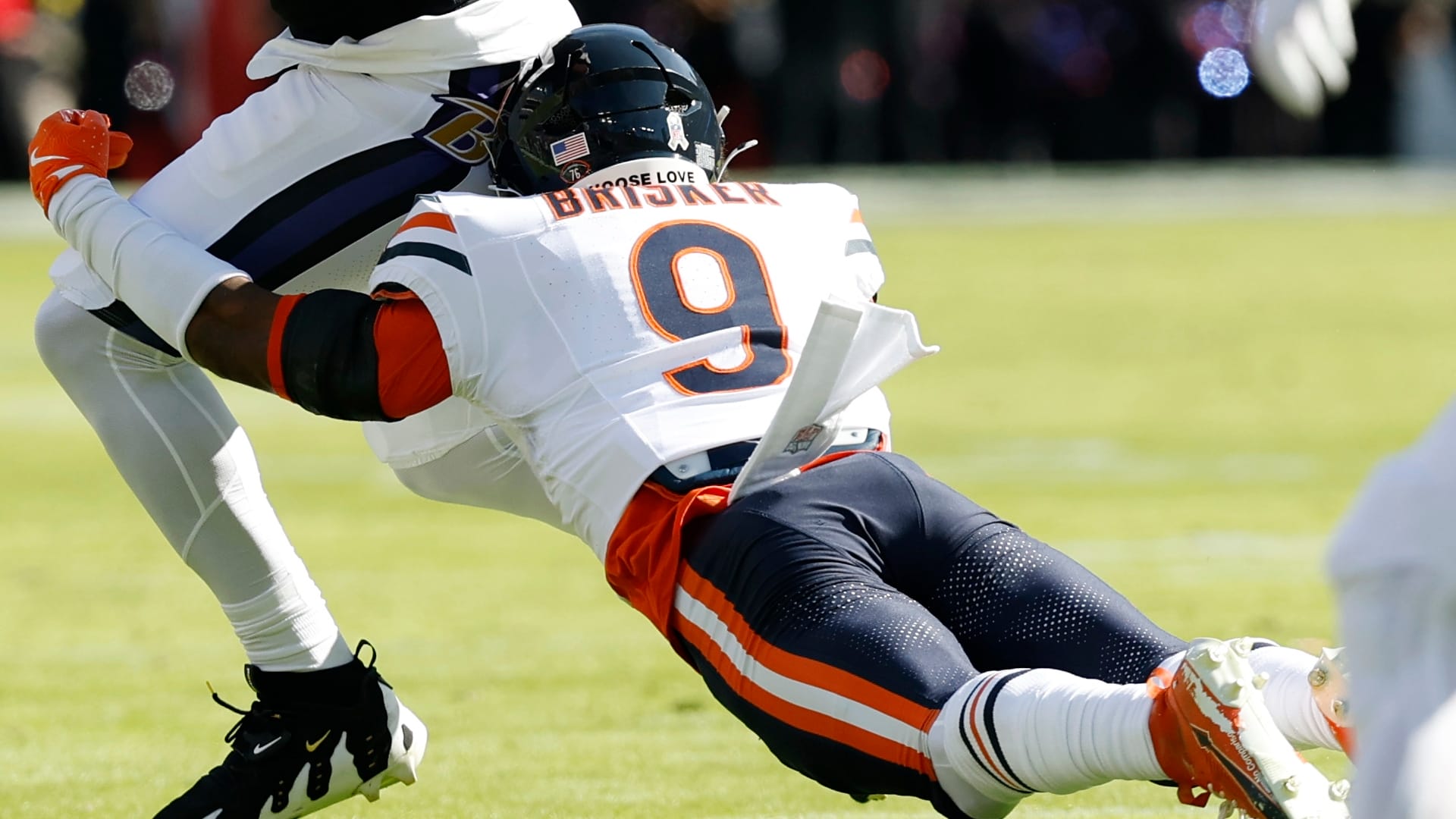 Baltimore Ravens tight end Isaiah Likely (80) runs with the ball after making a catch as Chicago Bears safety Jaquan Brisker (9) attempts a tackle in the second quarter at M&T Bank Stadium. Mandatory Credit: Geoff Burke-Imagn Images