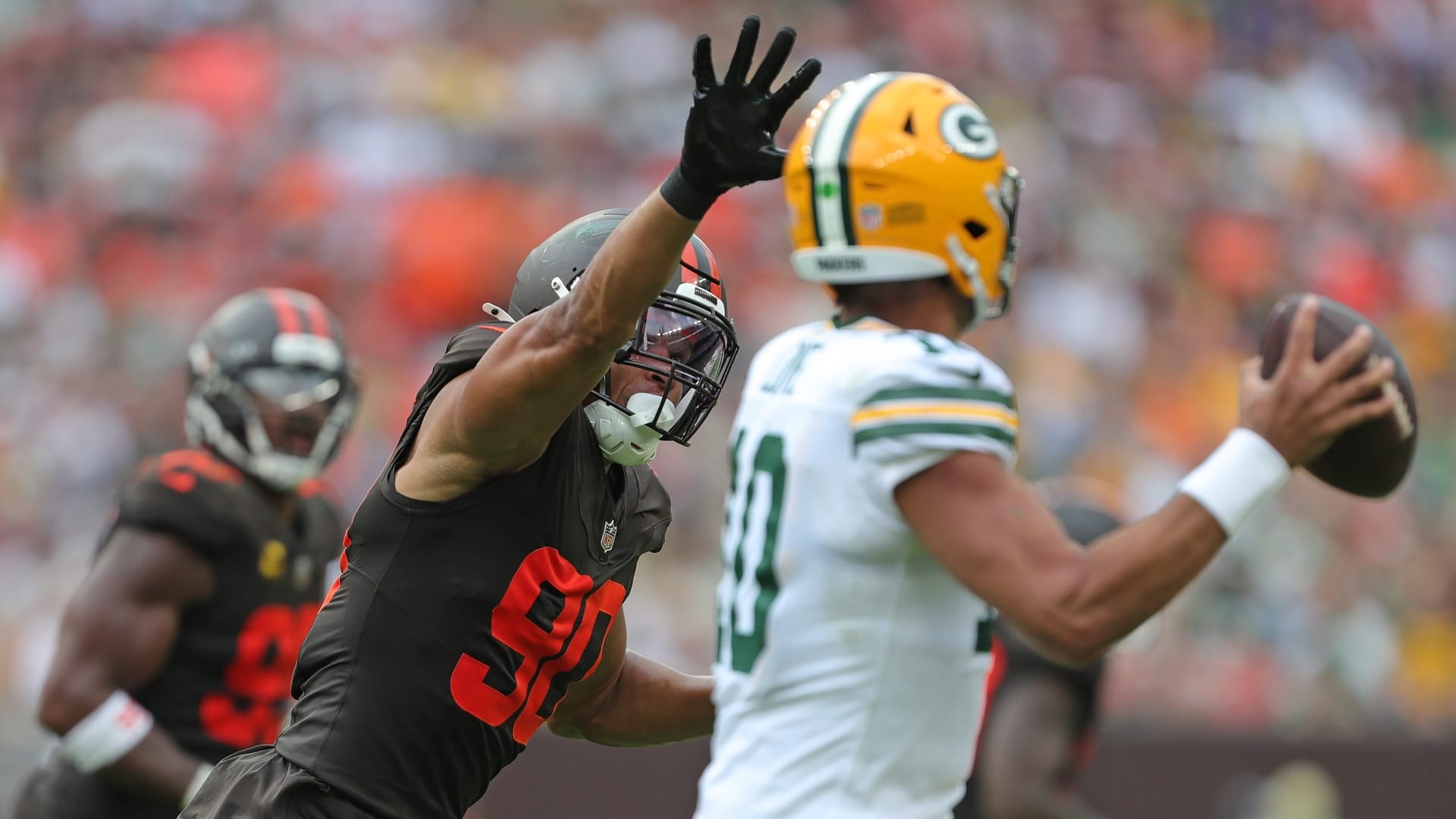 Cleveland Browns defensive end Joe Tryon-Shoyinka (90) pressures Green Bay Packers quarterback Jordan Love (10) during the second half of an NFL football game at Huntington Bank Field, Sept. 21, 2025, in Cleveland, Ohio.