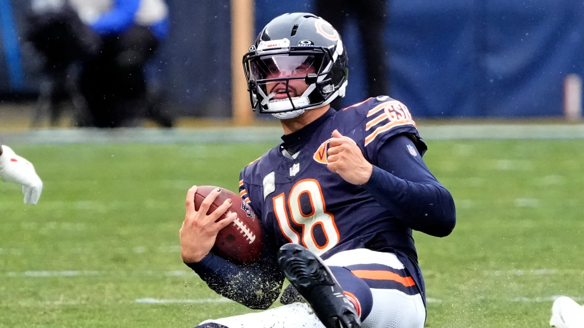 Chicago Bears quarterback Caleb Williams (18) slides in front of New York Giants linebacker Demetrius Flannigan-Fowles (33) and linebacker Bobby Okereke (58) during the first half at Soldier Field. Mandatory Credit: David Banks-Imagn Images