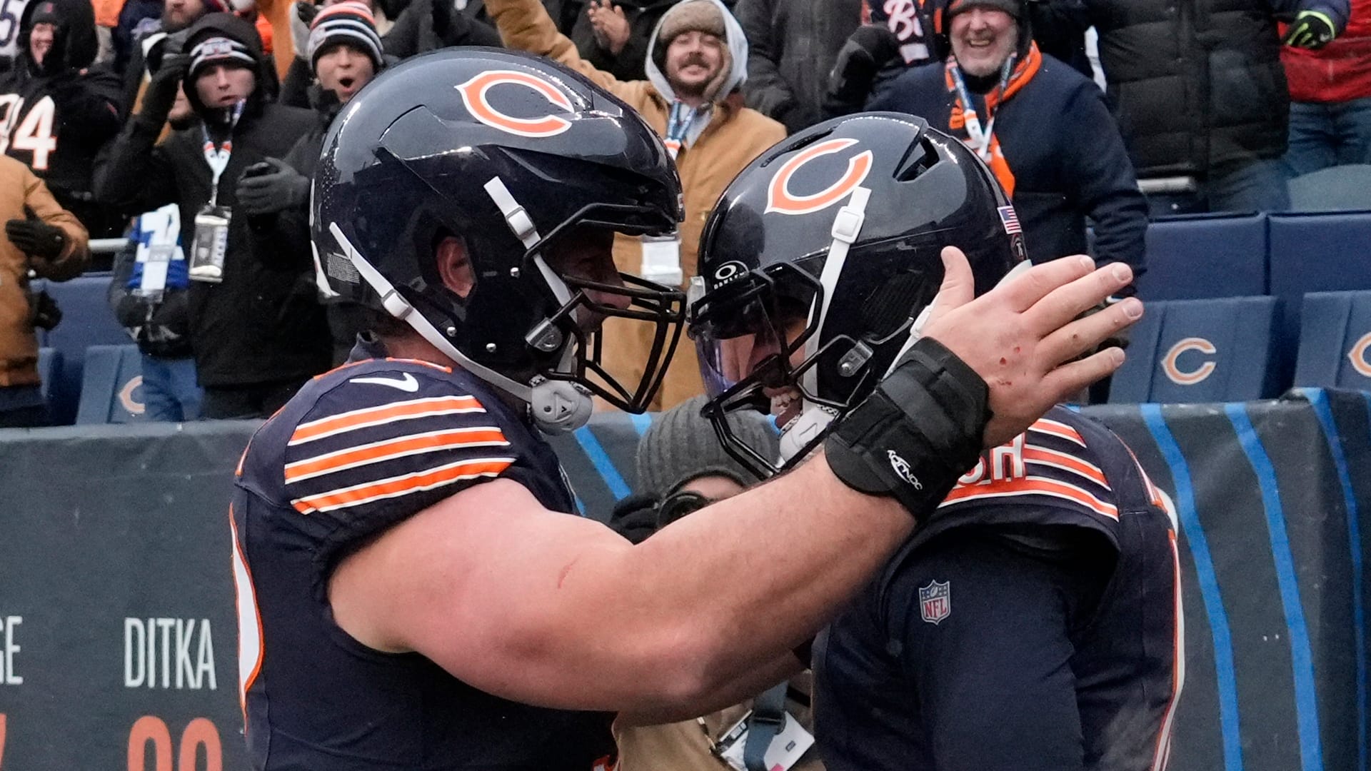 Chicago Bears quarterback Caleb Williams (18) celebrates with center Drew Dalman (52) after scoring the game-winning touchdown against New York Giants during the fourth quarter at Soldier Field. Mandatory Credit: David Banks-Imagn Images
