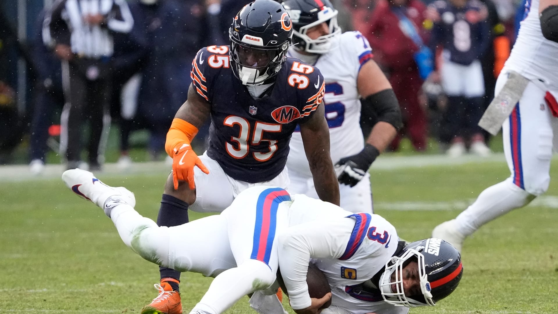 Chicago Bears safety C.J. Gardner-Johnson (35) sacks New York Giants quarterback Russell Wilson (3) during the second half at Soldier Field. Mandatory Credit: David Banks-Imagn Images