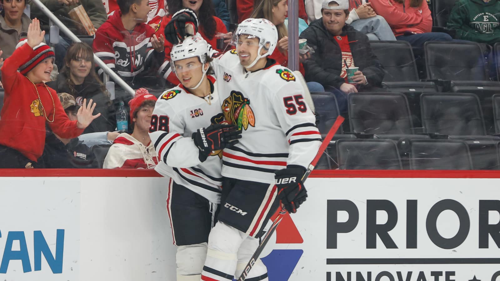 Nov 9, 2025; Detroit, Michigan, USA; Chicago Blackhawks center Connor Bedard (98) celebrates with defenseman Artyom Levshunov (55) after scoring a goal in the first period at Little Caesars Arena. Mandatory Credit: Brian Bradshaw Sevald-Imagn Images