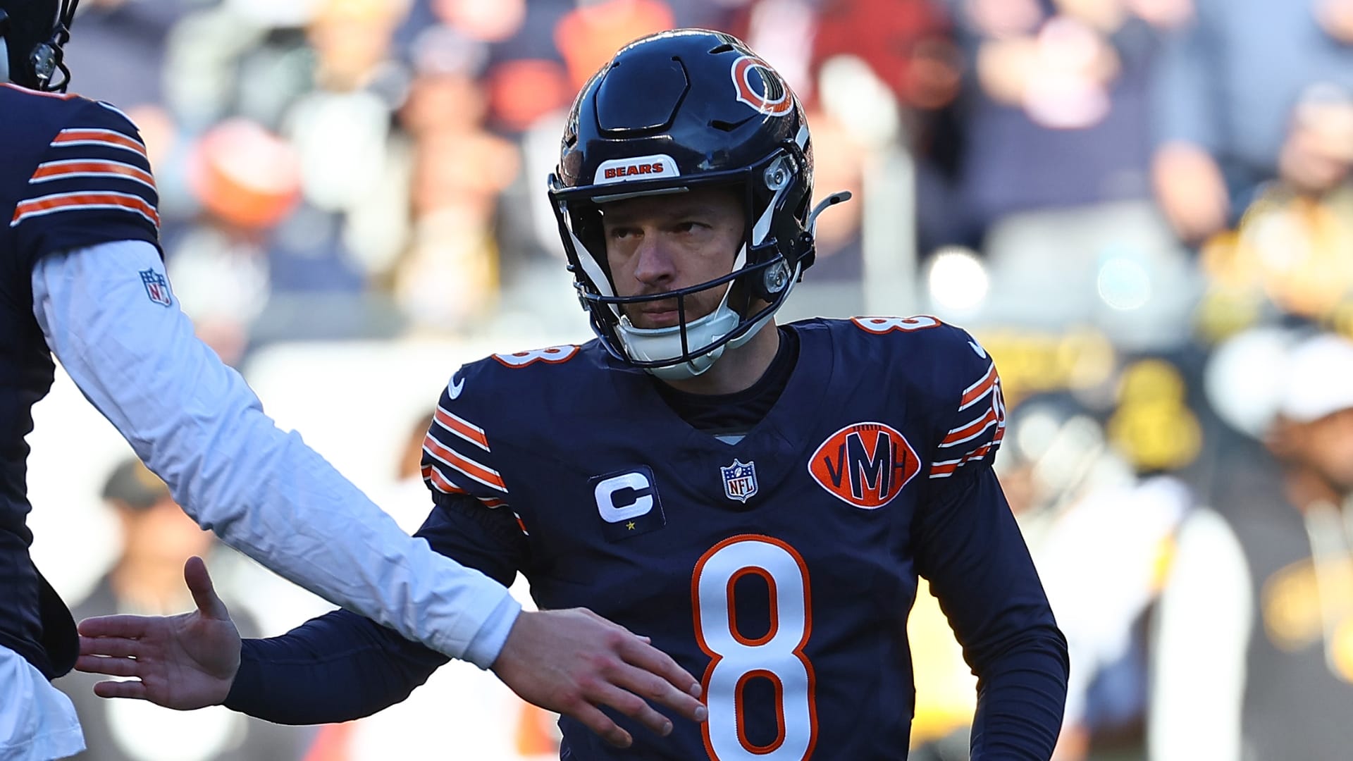 Chicago Bears place kicker Cairo Santos (8) reacts with punter Tory Taylor (19) after a PAT during the second half at Soldier Field. Mandatory Credit: Mike Dinovo-Imagn Images