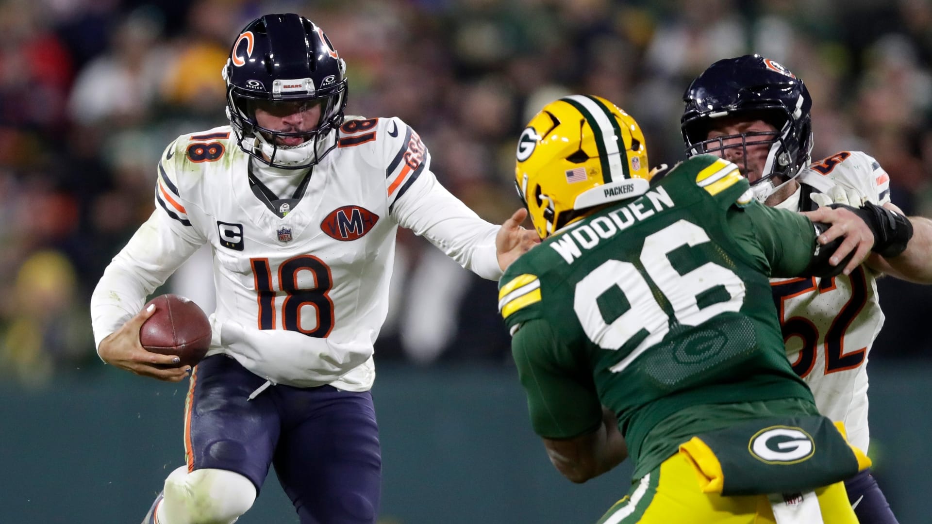 Chicago Bears quarterback Caleb Williams (18) runs the ball during a football game against the Green Bay Packers on Dec. 7, 2025, at Lambeau Field in Green Bay, Wis. The Packers defeated the Bears 28-21.