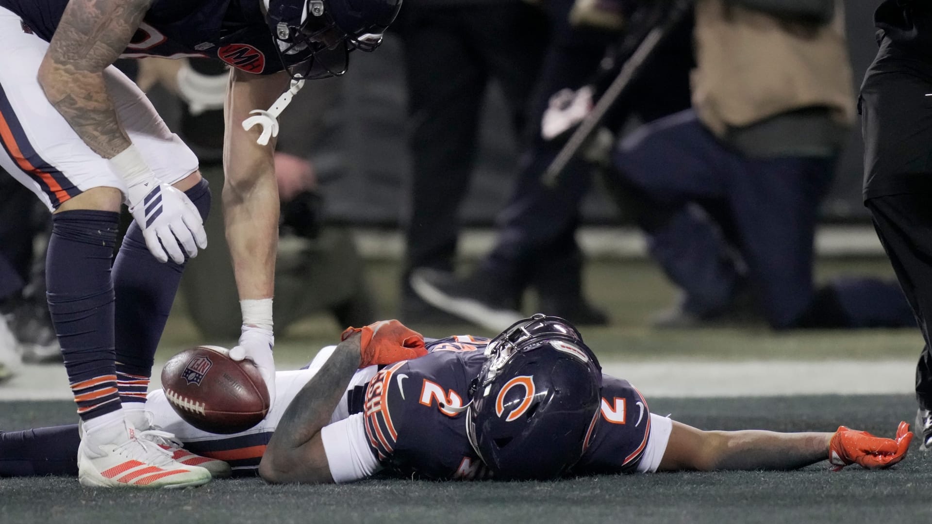 Chicago Bears wide receiver DJ Moore (2) lies on the turf after making the game-winning touchdown catch during overtime in their game Saturday, December 20, 2025 at Soldier Field in Chicago, Illinois. The Chicago Bears beat the Green Bay Packers 22-16 in overtime.