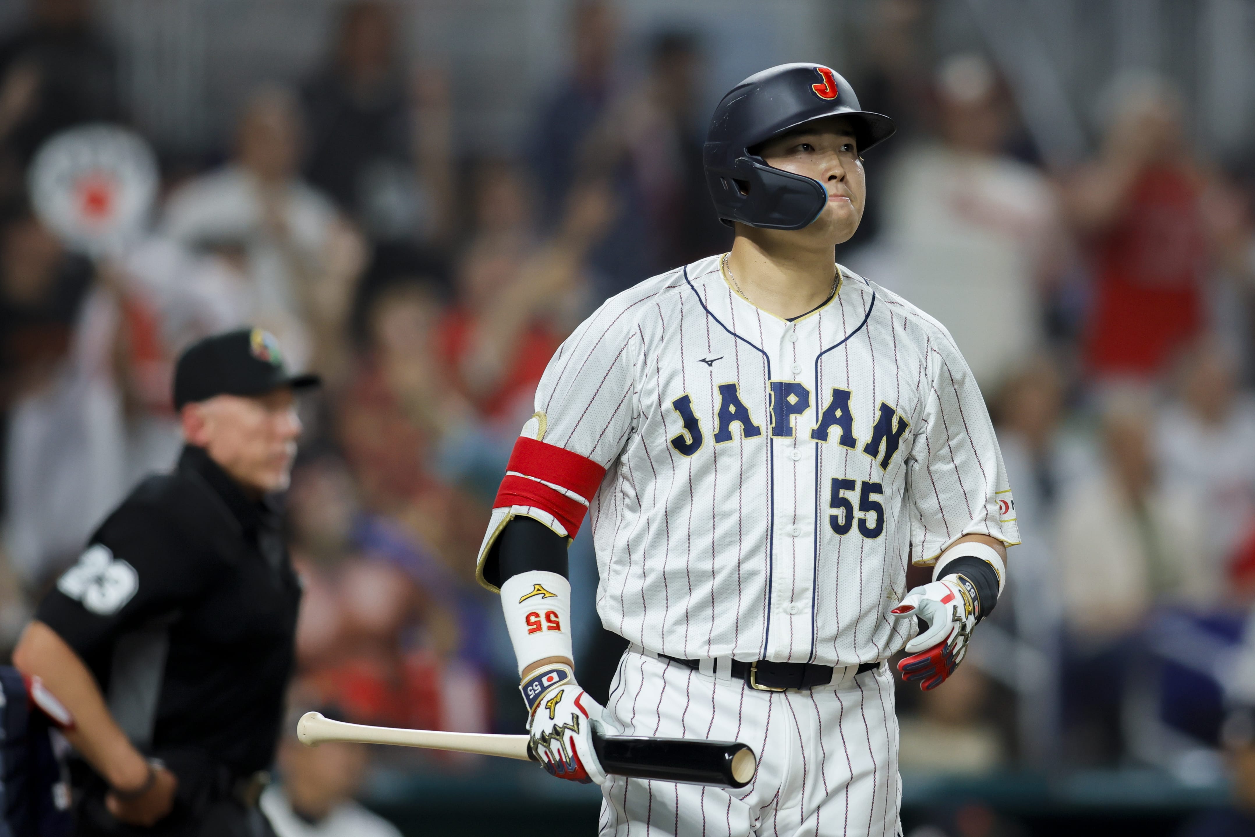 Mar 21, 2023; Miami, Florida, USA; Japan third baseman Munetaka Murakami (55) looks on after hitting a home run during the second inning against USA at LoanDepot Park. Mandatory Credit: Sam Navarro-USA TODAY Sports