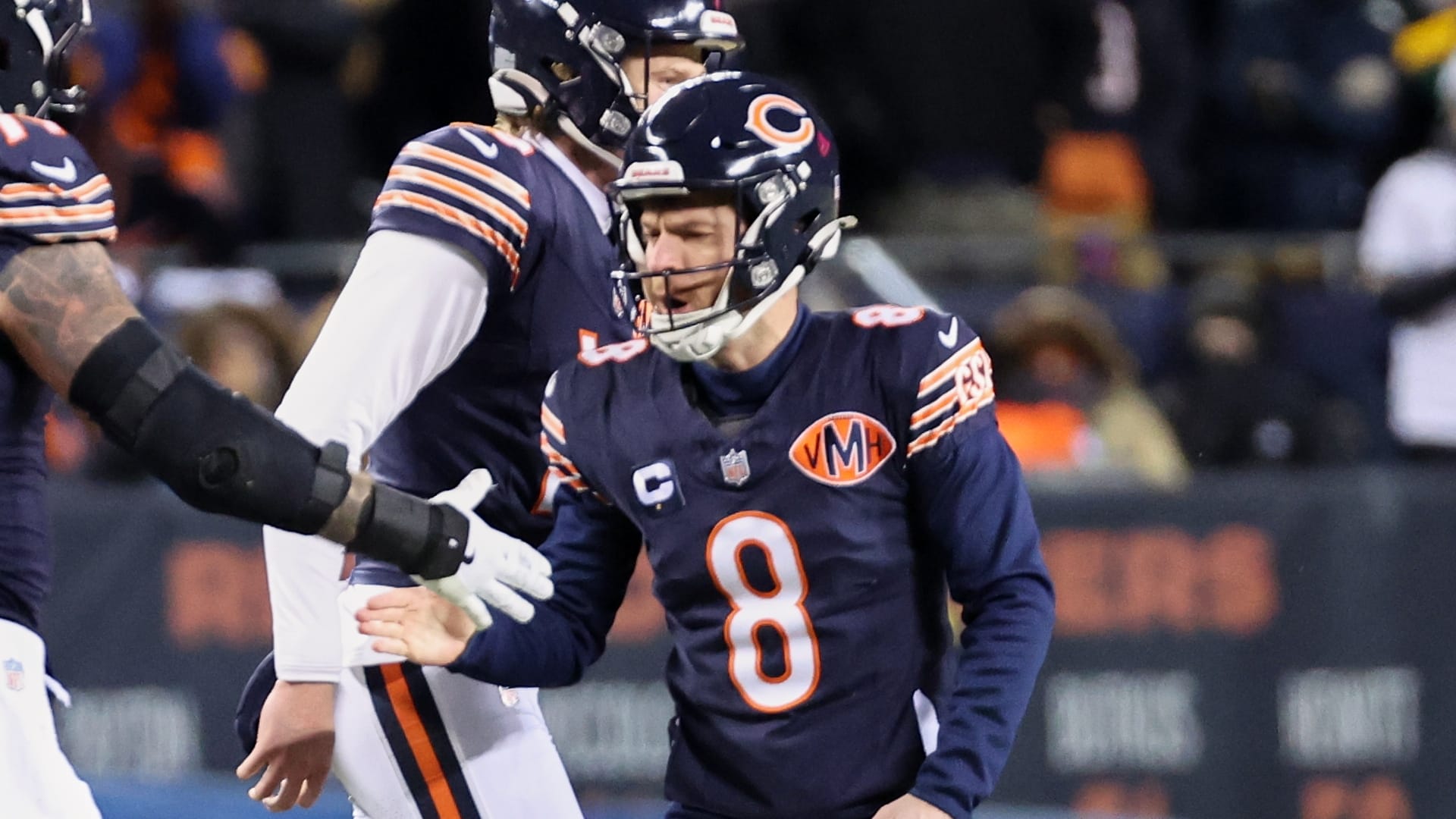 Chicago Bears placekicker Cairo Santos (8) shakes hands with center Ryan Bates (71) after kicking the game-tying extra point against the Green Bay Packers with twenty-four seconds remaining in the fourth quarter at Soldier Field. Mandatory Credit: Mike Dinovo-Imagn Images