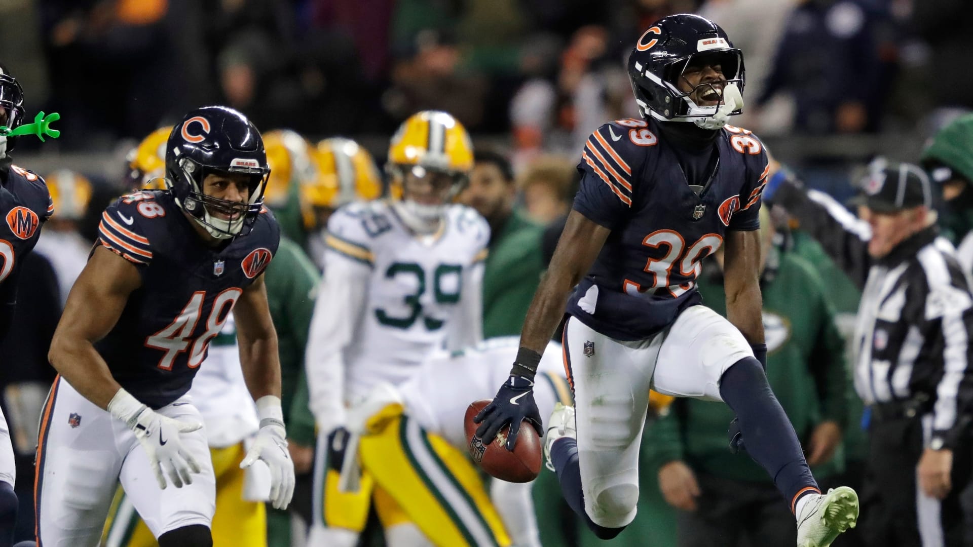 Chicago Bears cornerback Josh Blackwell (39) celebrates recovering an onside kick mishandled by Green Bay Packers wide receiver Romeo Doubs (87) in the fourth quarter during their football game Saturday, December 20, 2025, at Soldier Field in Chicago, Illinois.