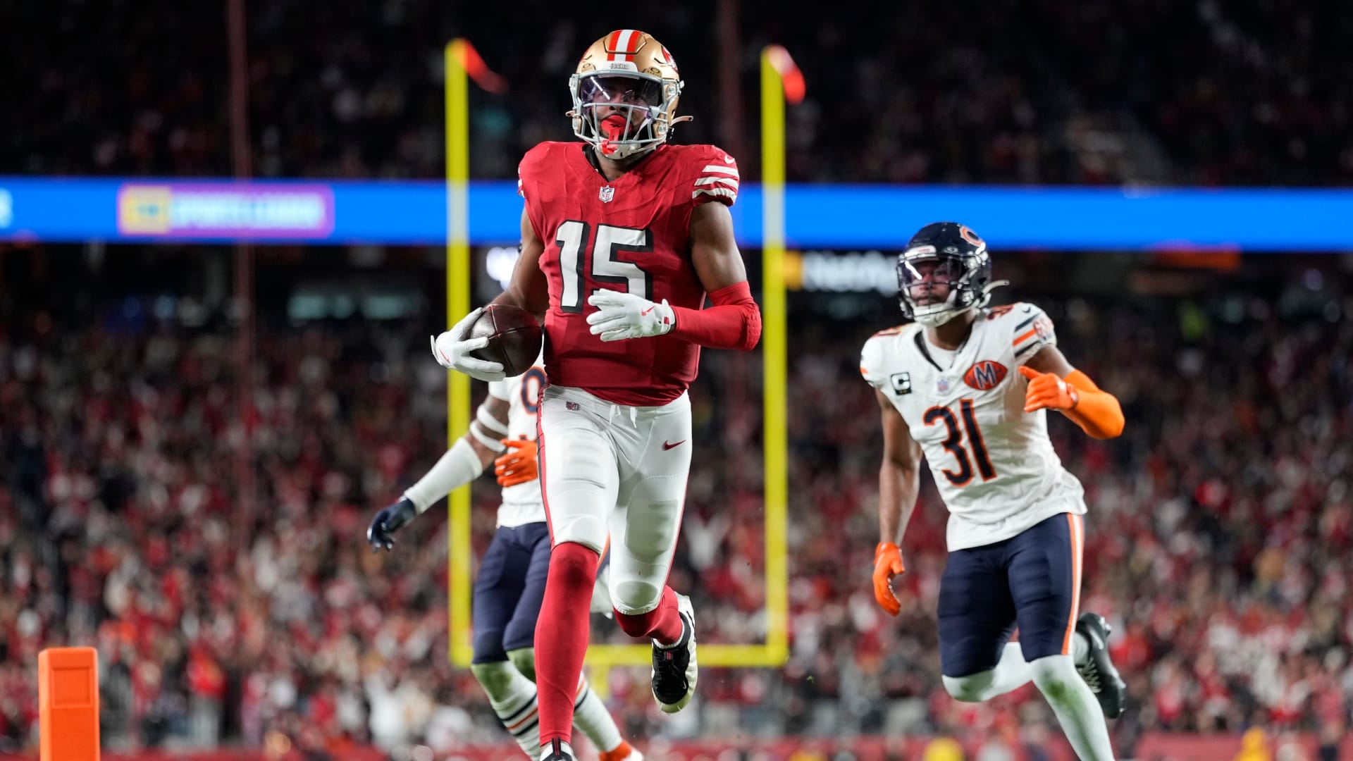 Dec 28, 2025; Santa Clara, California, USA; San Francisco 49ers wide receiver Jauan Jennings (15) runs to score a touchdown against the Chicago Bears in the second half at Levi's Stadium.