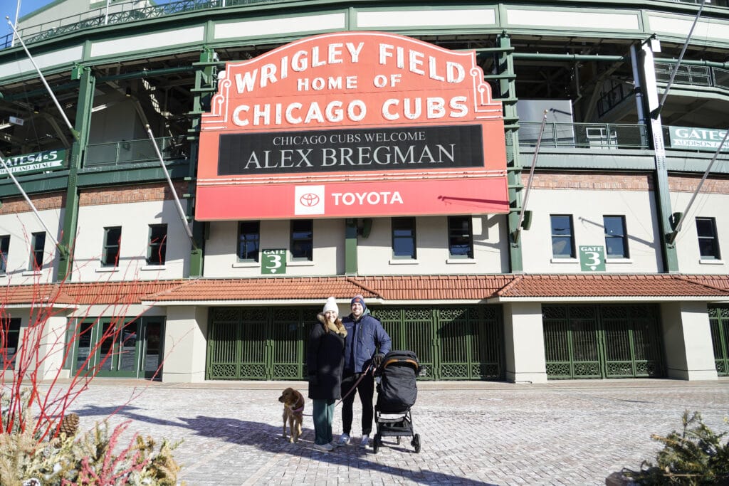 Jan 15, 2026; Chicago, Illinois, USA; Catrina Connelly Patrick Connelly and baby Declan pose for a photo outside of the Chicago Cubs marquee announcing the Cubs new player Alex Bregman.