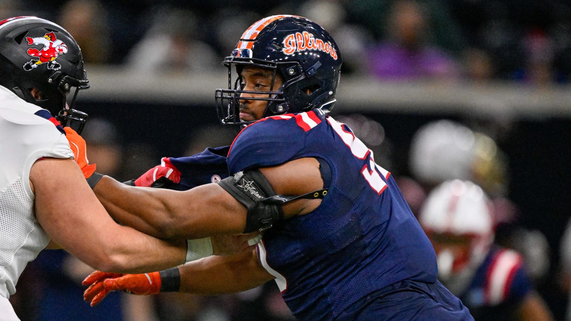 East offensive lineman Pete Nygra (50) blocks West defensive lineman James Thompson Jr. (90) during the first half at the Ford Center at the Star. Mandatory Credit: Jerome Miron-Imagn Images