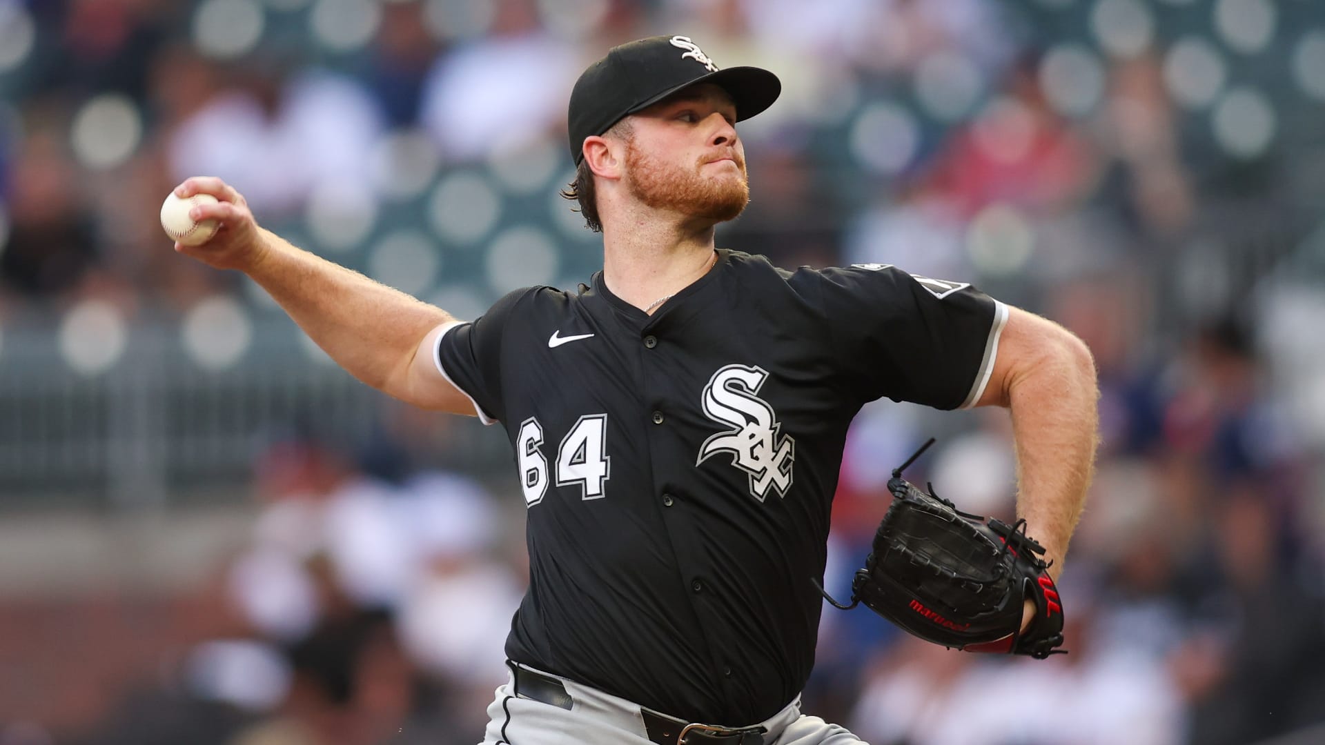 Aug 19, 2025; Atlanta, Georgia, USA; Chicago White Sox starting pitcher Shane Smith (64) throws against the Atlanta Braves in the first inning at Truist Park. Mandatory Credit: Brett Davis-Imagn Images