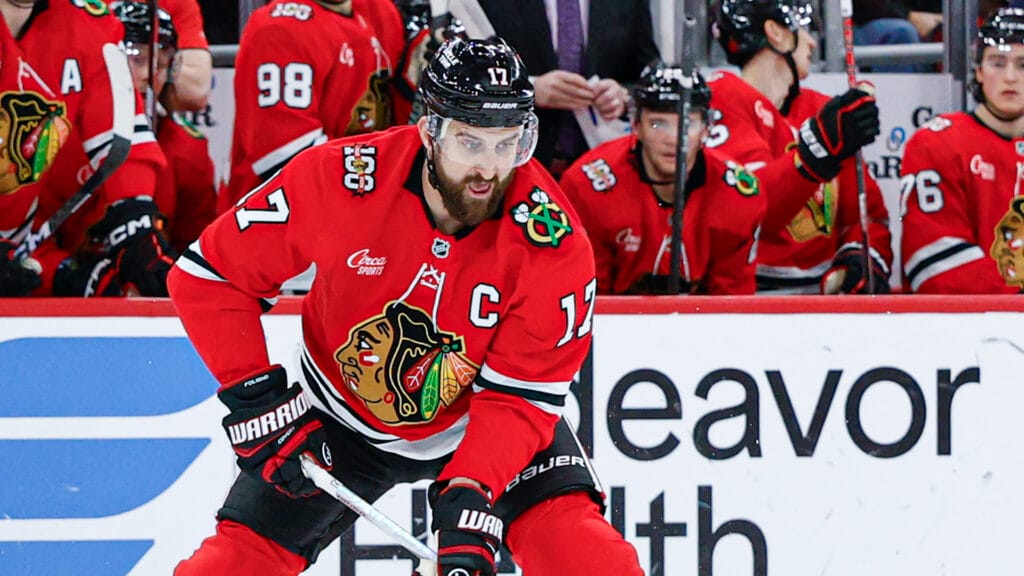 Chicago Blackhawks left wing Nick Foligno (17) looks to pass the puck against the Calgary Flames during the first period at United Center. Mandatory Credit: Kamil Krzaczynski-Imagn Images
