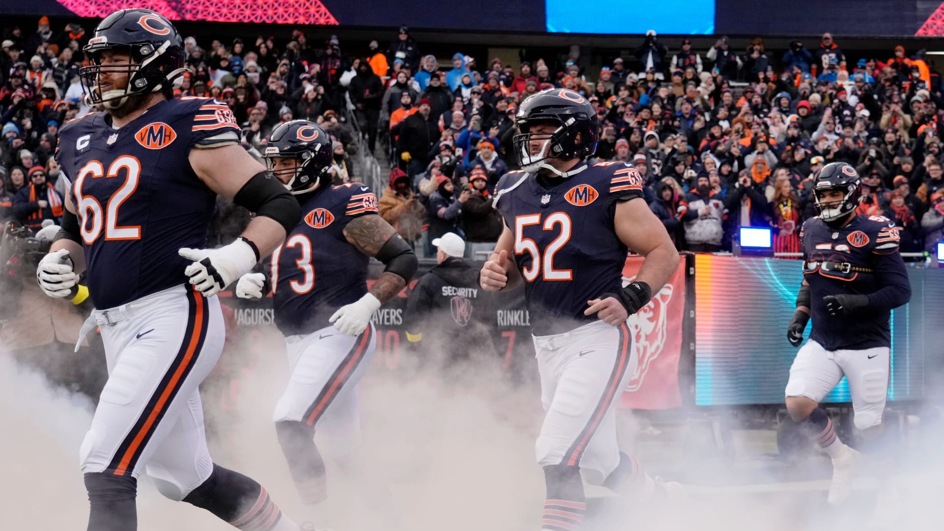 Jan 4, 2026; Chicago, Illinois, USA; Chicago Bears guard Joe Thuney (62) and center Drew Dalman (52) run onto the field before the game between the Chicago Bears and the Detroit Lions at Soldier Field. Mandatory Credit: David Banks-Imagn Images