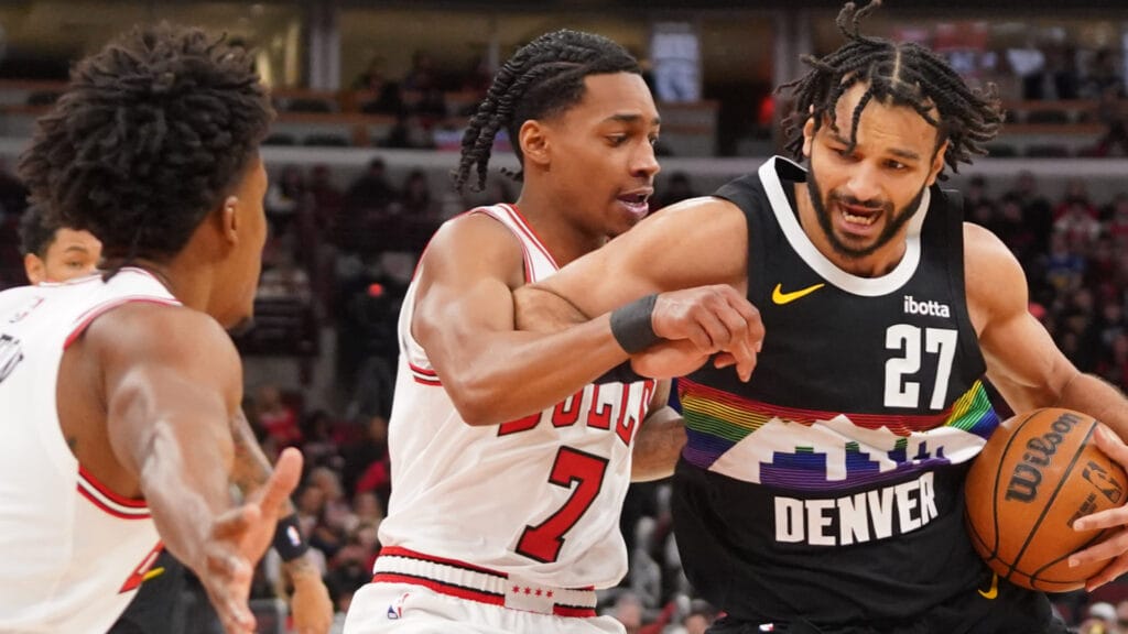 Feb 7, 2026; Chicago, Illinois, USA; Chicago Bulls guard Rob Dillingham (7) defends Denver Nuggets guard Jamal Murray (27) during the first half at United Center.