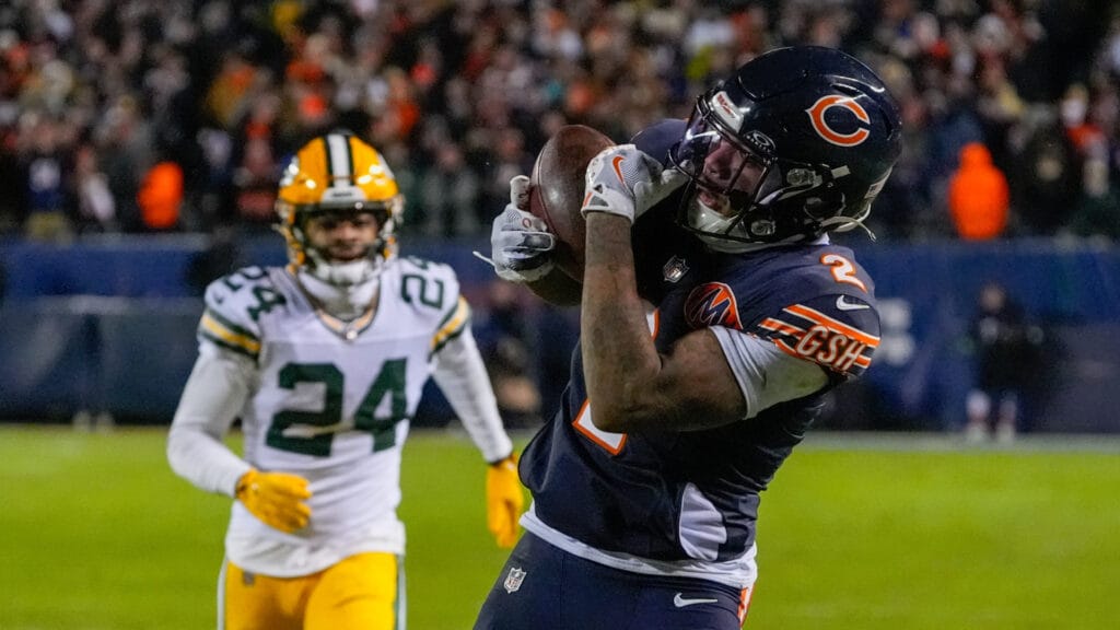 Jan 10, 2026; Chicago, IL, USA; Chicago Bears wide receiver DJ Moore (2) makes the eventual game winning touchdown catch against the Green Bay Packers during the second half of an NFC Wild Card Round game at Soldier Field. Mandatory Credit: David Banks-Imagn Images
