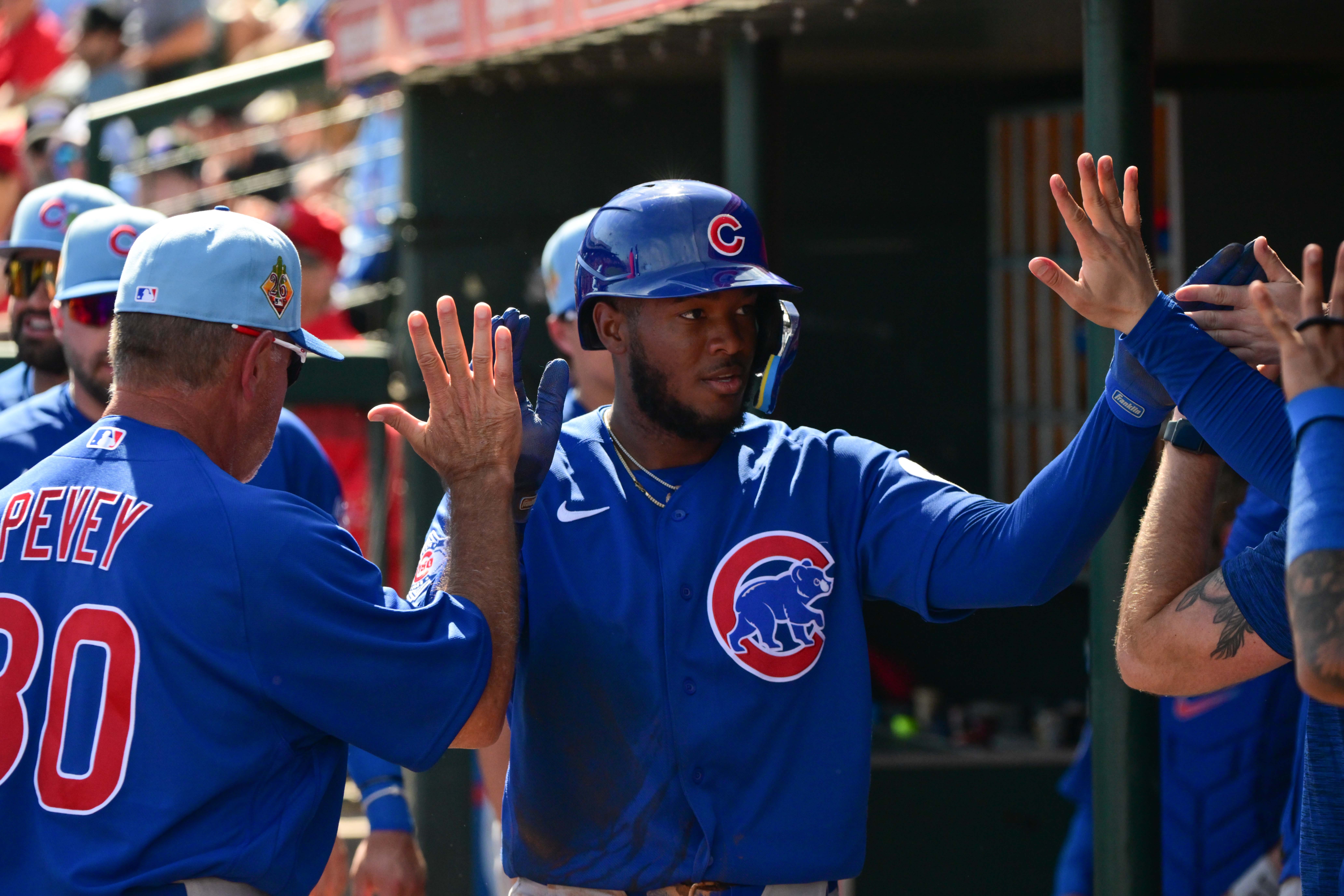 Feb 26, 2026; Tempe, Arizona, USA; Chicago Cubs shortstop Jefferson Rojas (93) celebrates with teammates after scoring a run in the first inning against the Los Angeles Angels at Tempe Diablo Stadium.