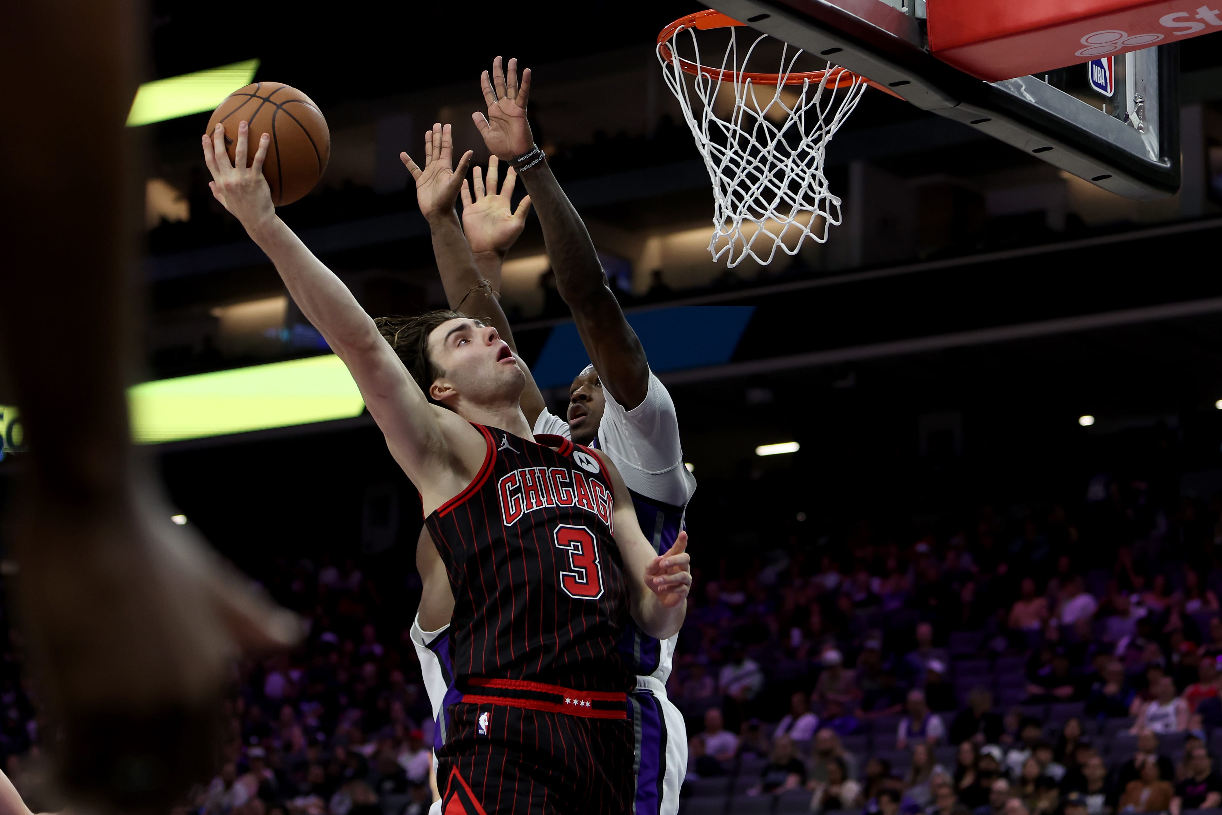 Mar 8, 2026; Sacramento, California, USA; Chicago Bulls guard Josh Giddey (3) shoots over Sacramento Kings guard-forward Daeqwon Plowden (29) during the fourth quarter at Golden 1 Center.