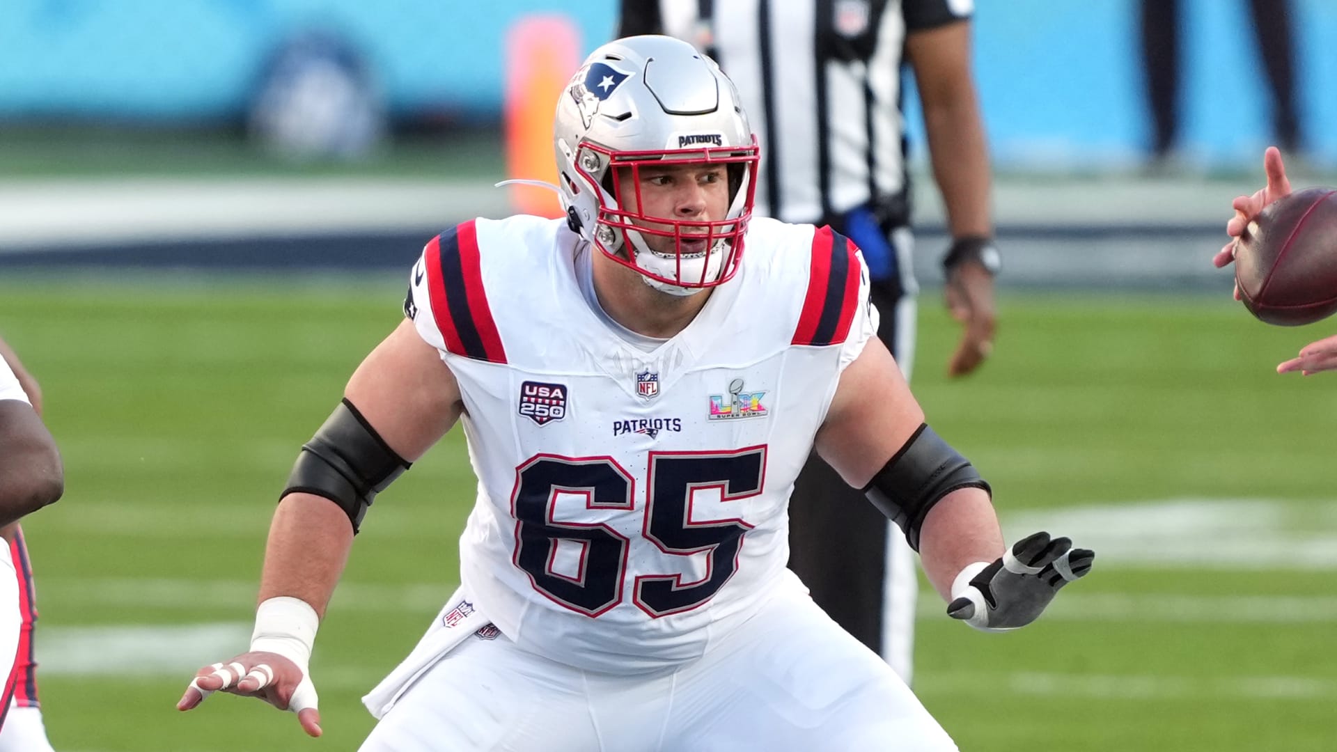 Feb 8, 2026; Santa Clara, CA, USA; New England Patriots center Garrett Bradbury (65) blocks against the Seattle Seahawks during the first quarter in Super Bowl LX at Levi's Stadium. Mandatory Credit: Darren Yamashita-Imagn Images