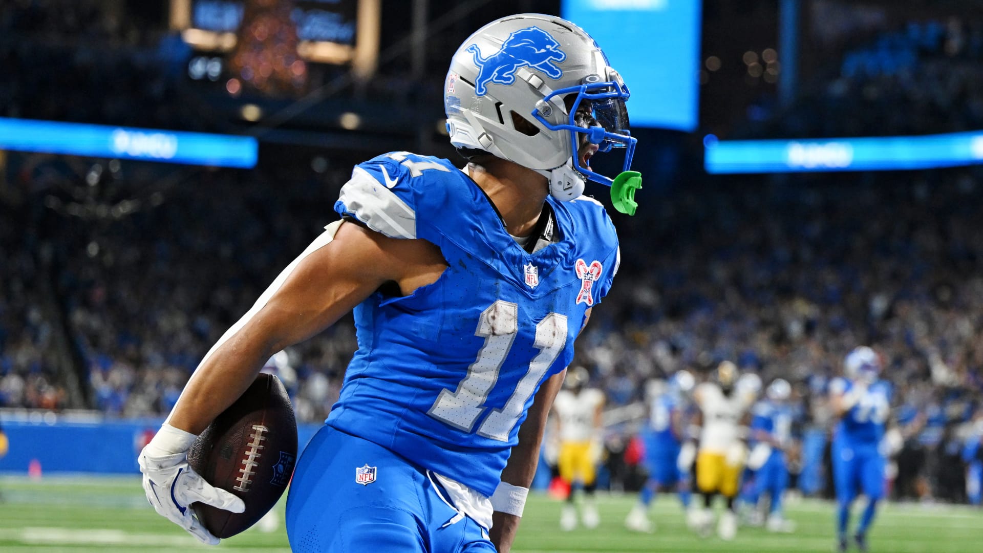 Dec 21, 2025; Detroit, Michigan, USA; Detroit Lions wide receiver Kalif Raymond (11) celebrates after scoring a touchdown during the fourth quarter against the Pittsburgh Steelers at Ford Field.