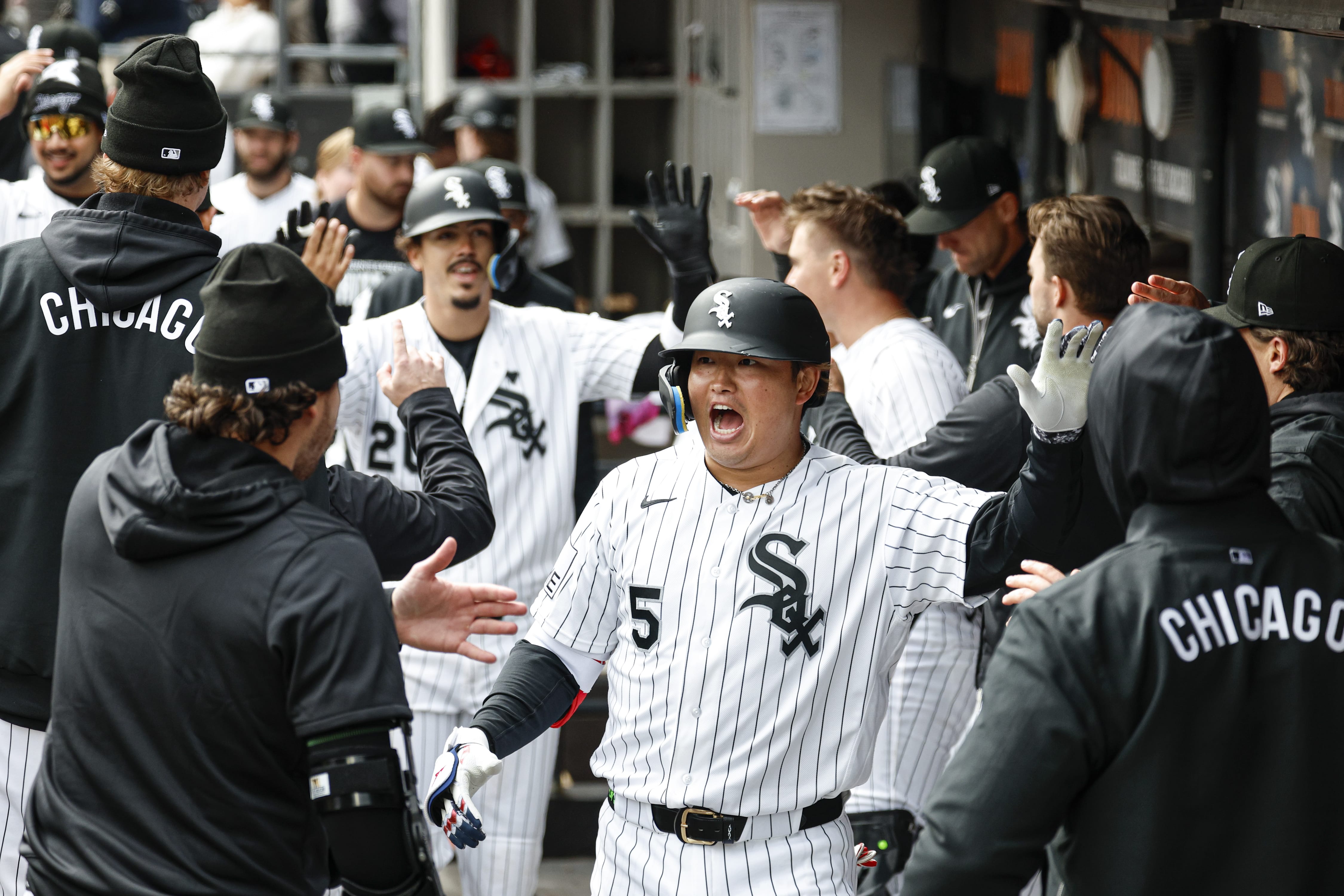 Apr 4, 2026; Chicago, Illinois, USA; Chicago White Sox first baseman Munetaka Murakami (5) celebrates with teammates in the dugout after hitting a two-run home run against the Toronto Blue Jays during the sixth inning at Rate Field.