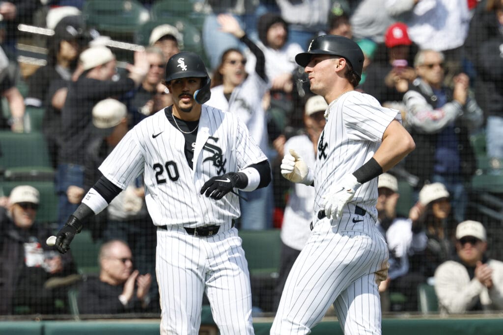 Apr 3, 2026; Chicago, Illinois, USA; Chicago White Sox third baseman Miguel Vargas (20) and shortstop Colson Montgomery (12) celebrate after scoring against the Toronto Blue Jays during the third inning at Rate Field.